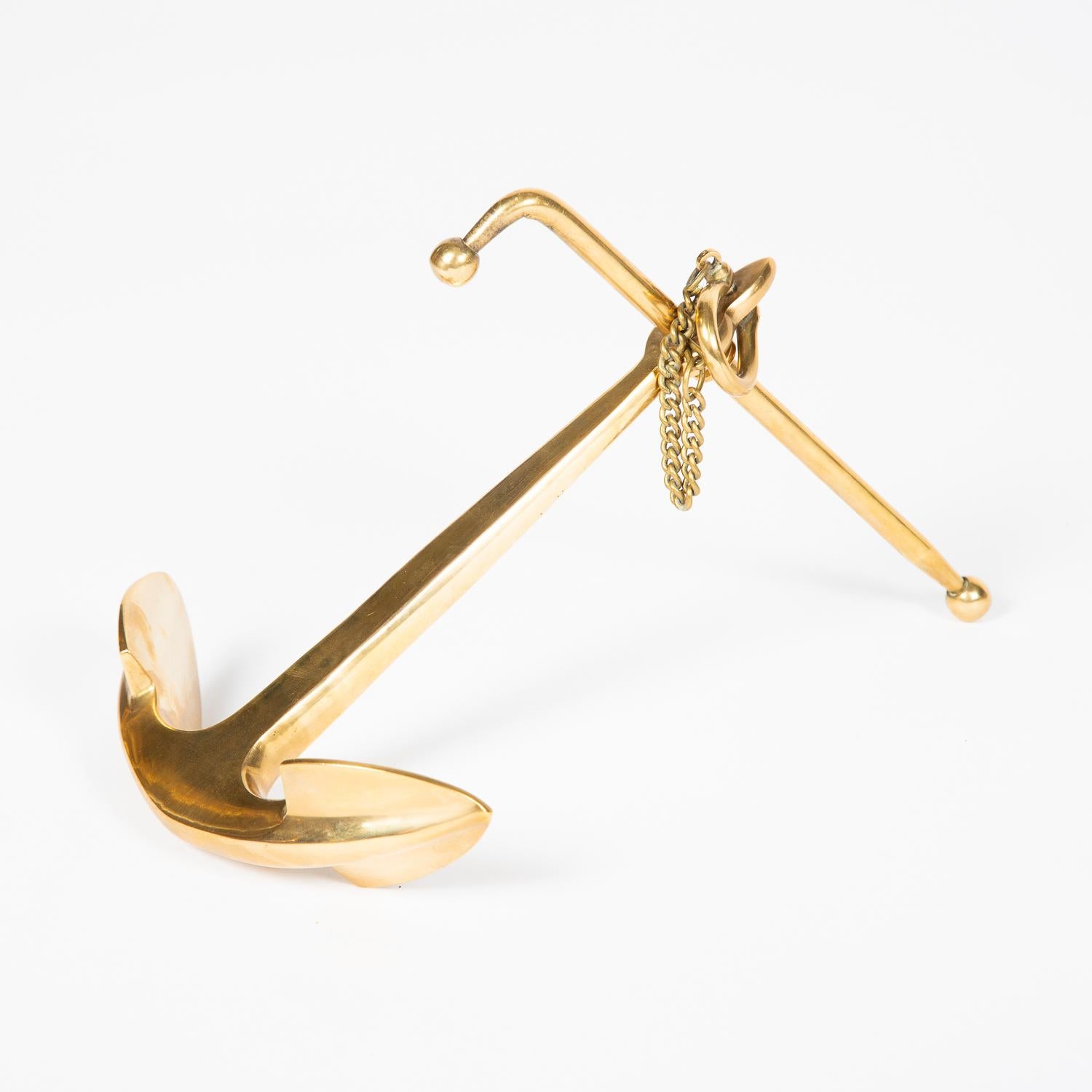 A brass desk top model of a Kedge admiralty anchor.

Well modeled with Shank, stock, crown, flukes, shackle and keep pin.

 