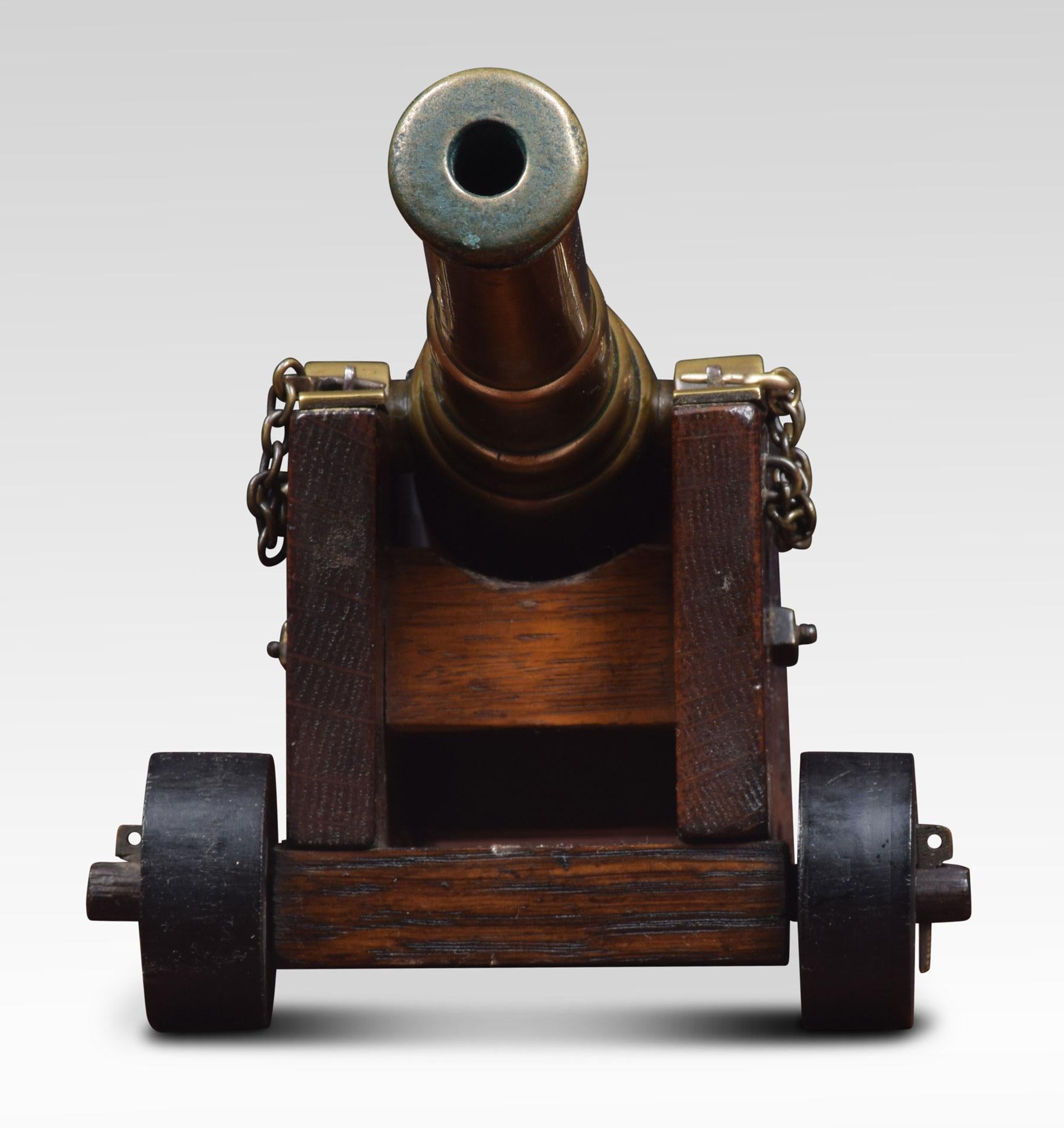 Brass desktop model of a signal cannon having 7.5 Inches barrel on oak carriage.
Dimensions
Height 5 inches
Width 8.5 inches
Depth 4.5 inches.