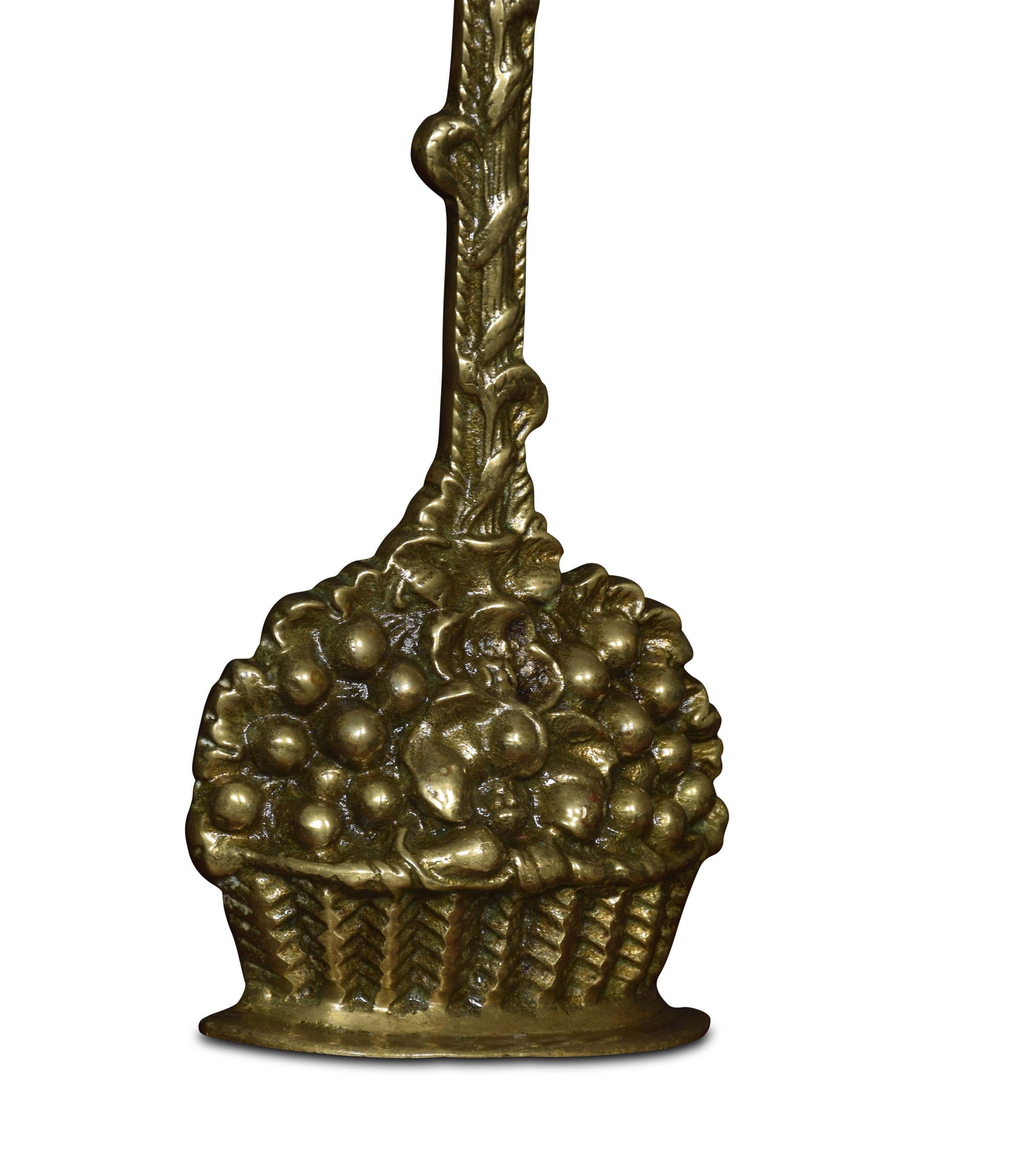 Brass doorstop in the form of a basket of fruit and flowers below a handle cast with entwined wheatears.
Dimensions
Height 14 inches
Width 6 inches
Depth 2 inches.
