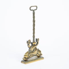 Brass door stop with two Intertwined Dolphins