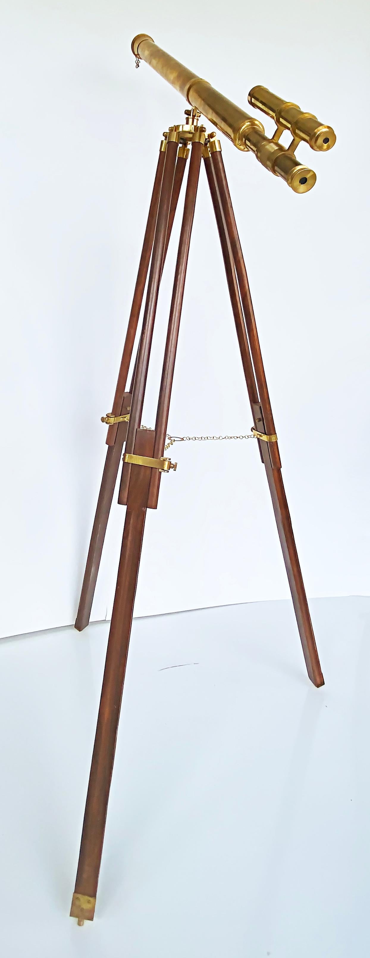 Brass Double Telescope Mounted on Adjustable Tripod Wooden, Brass Mounted Stand

Offered for sale is a finely machined brass double telescope mounted on an adjustable mahogany base with a brass-mounted stand. This is a great object for display in