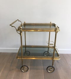 Brass Drinks Trolley with Blueish Glass shelves by Maison Jansen