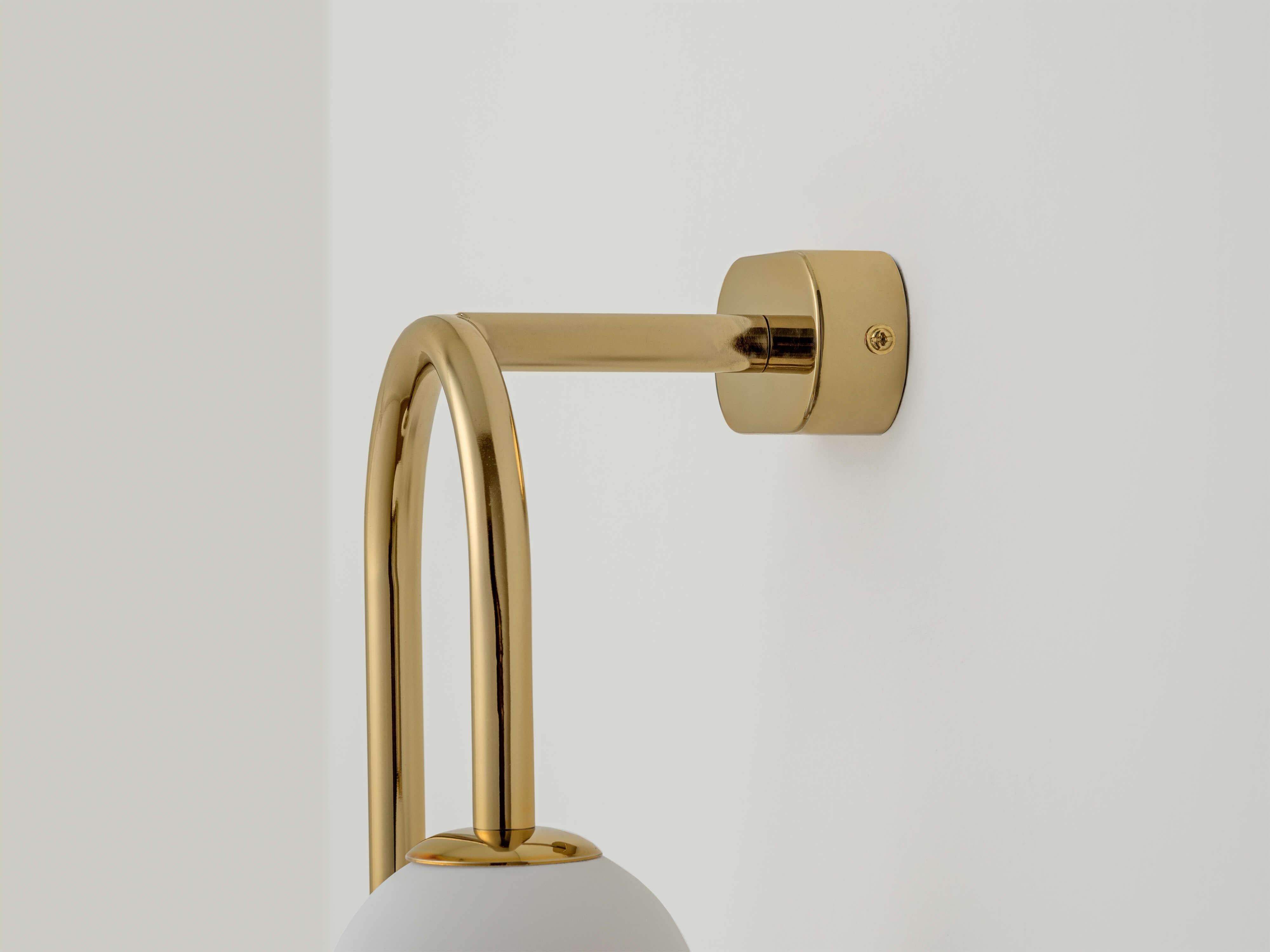The brass drop curve wall light by houseof is a statement piece which will add character to your home. Hang in pairs full maximum impact. Wall lights are a great space saving option and add pockets of light to dark corners. Hung in multiples they