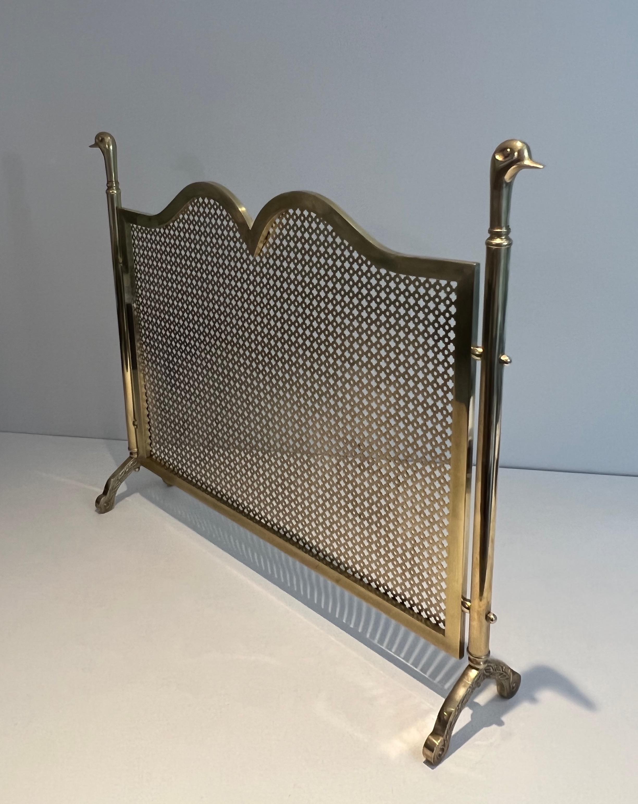 This duck heads fireplace screen is made of brass. This is a French work in the style of Maison Jansen.. Circa 1970