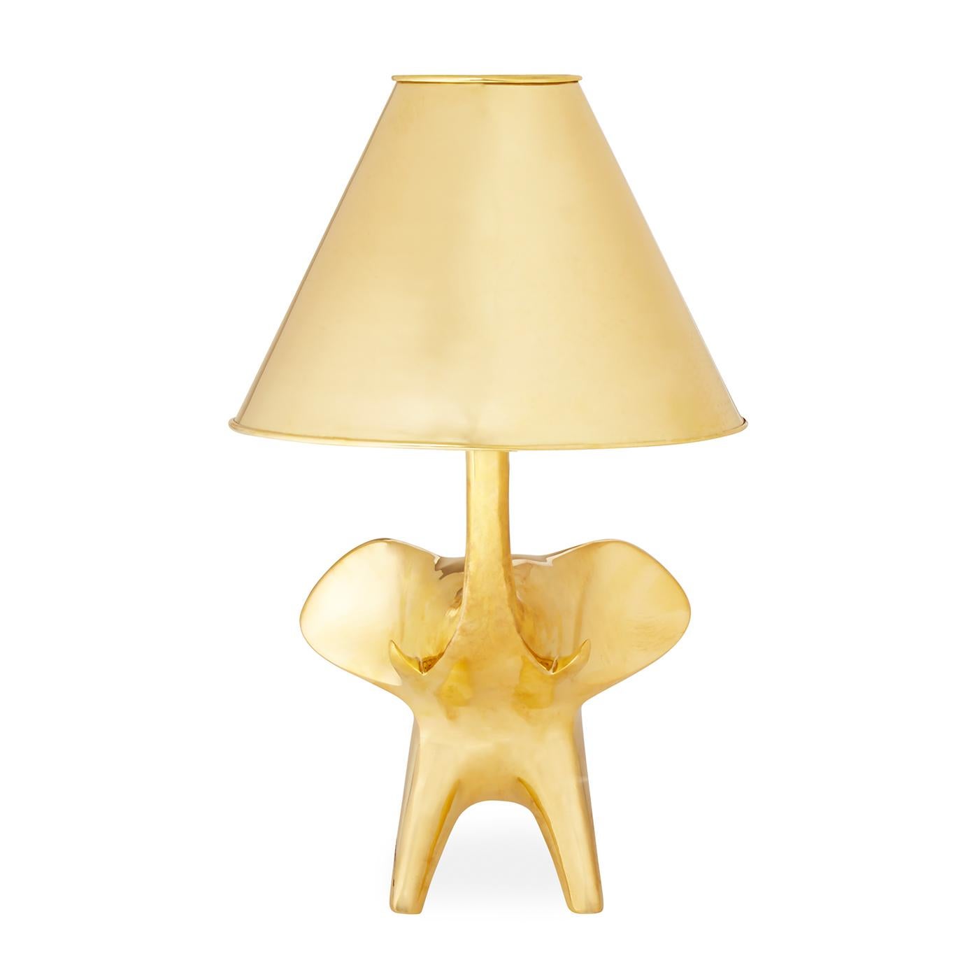 Posh Pachyderm. As majestic as it is mignon, our brass elephant table lamp is radically radiant. JA originally sculpted the pachyderm in our Soho pottery studio then rendered it in solid brass, including the couture-tapered shade. The perfect blend