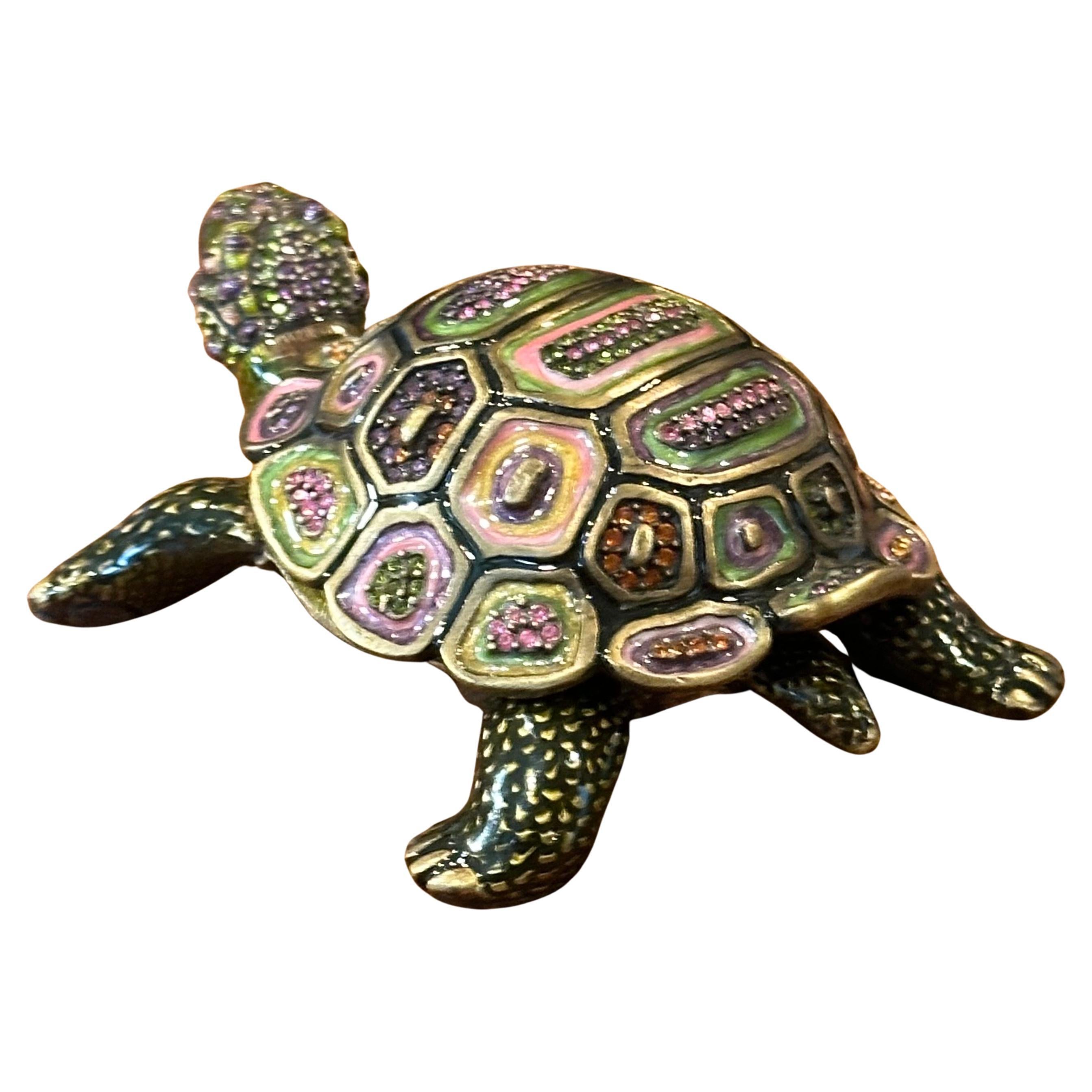 A gorgeous brass, enamel Swarovski crystals turtle trinket box by Jay Strongwater, circa 2000s. The box features an impressive jeweled and enameled shell and measures 4