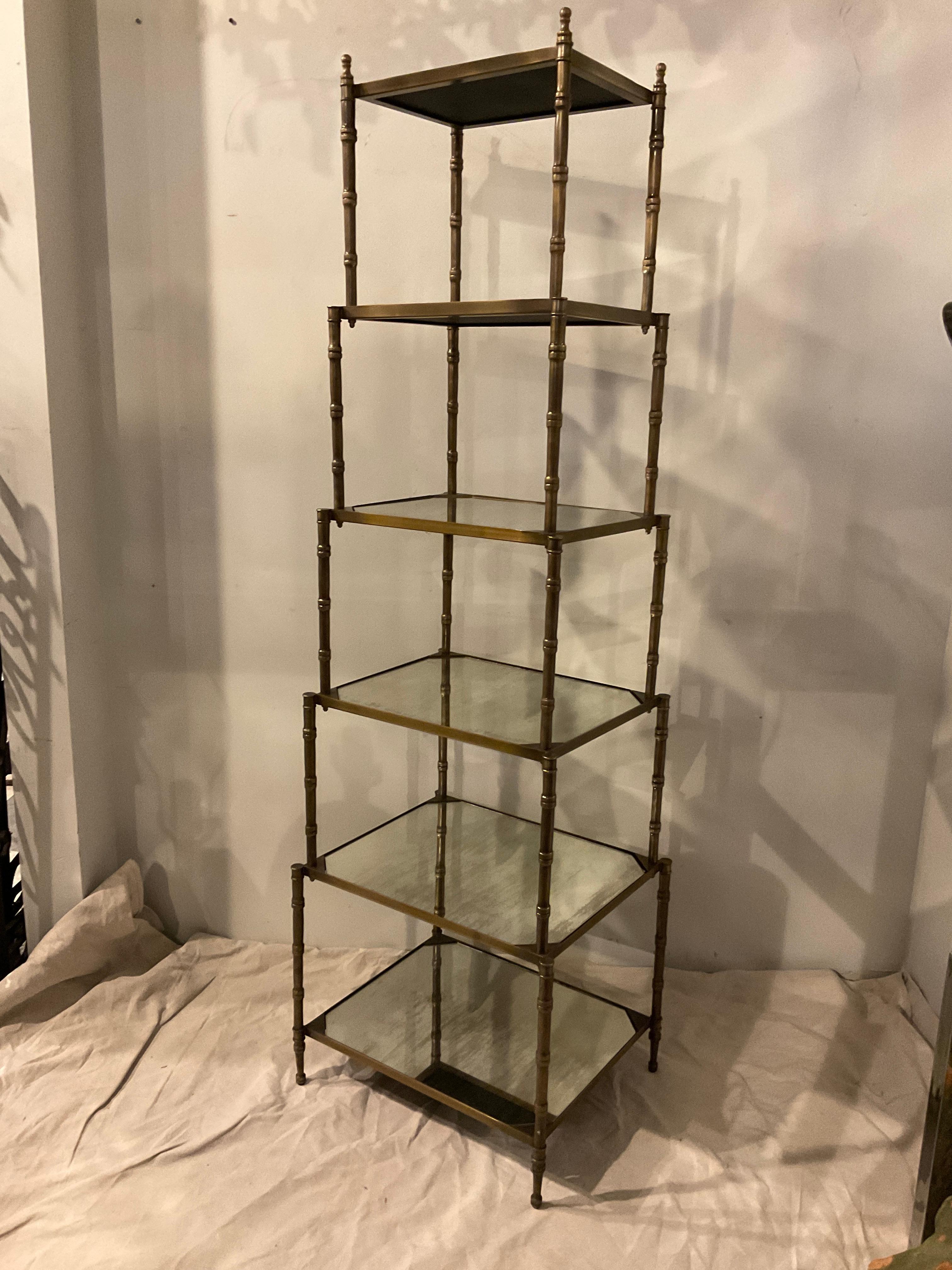 Brass etagere with antiqued mirror shelves.