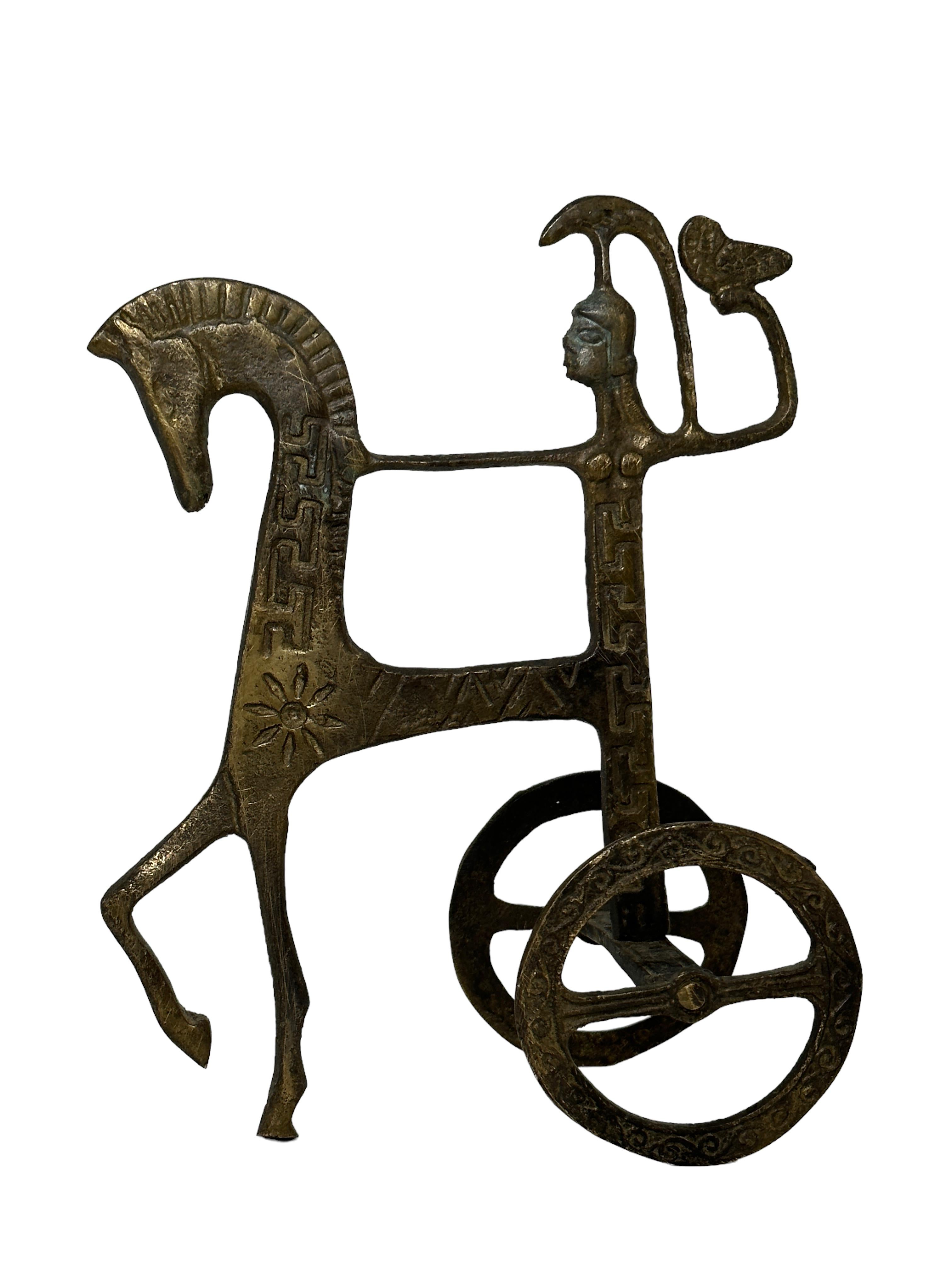 This is a bronze sculpture, which may have been done by Frederic Weinberg.
It is an incredibly stylized Roman Chariot and has a patina finish. Italian-made and great for any Mid-Century Modern interior.
It looks like the work of Frederic Weinberg