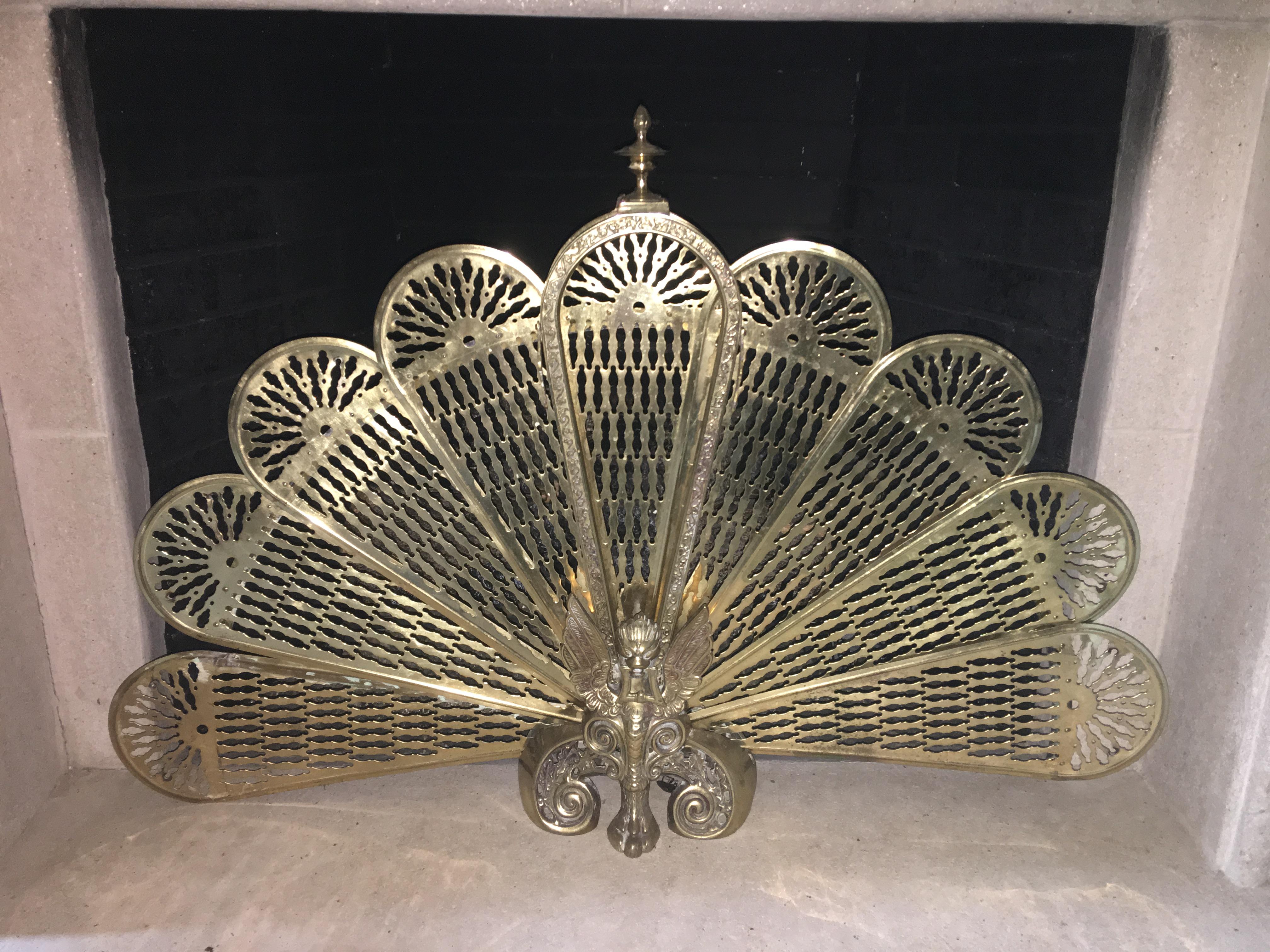 Brass fan screen with a decorative finial, 19th century. Measures: Base is 9