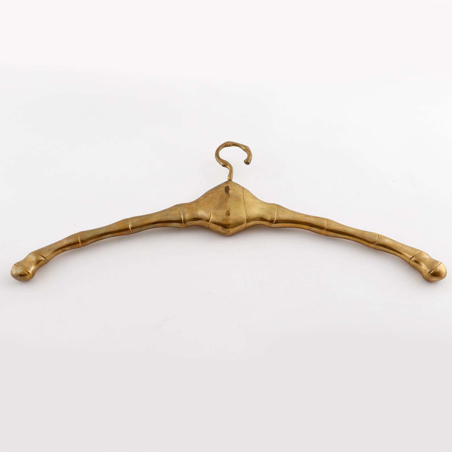 A faux bamboo coat hanger made of solid and naturally aged brass with lovely patina. The piece is manufactured in midcentury in 1960s.