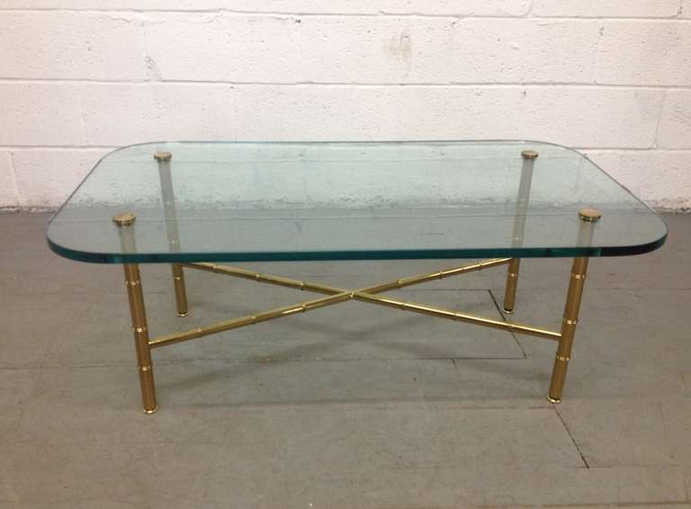 Brass faux bamboo coffee table. Maison Baguès style glass top and 