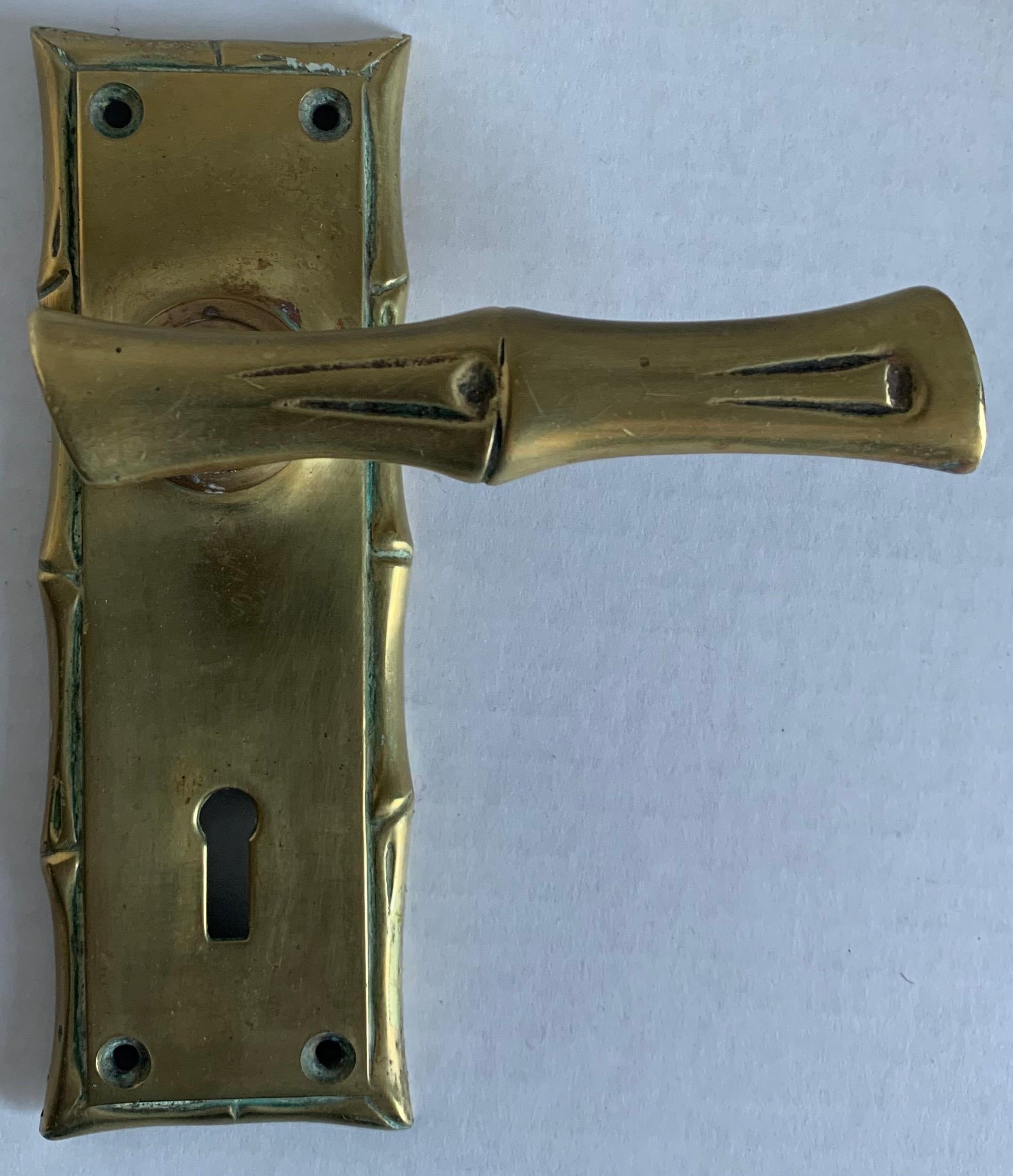 Single cast brass faux bamboo door handles. Right facing door handle. Faux bamboo handle is 4” wide. Backplate is 6” tall x 2” wide x 2” deep. Installation hardware not included. Overall unpolished patina. Can be re-plated in brass or nickel for an