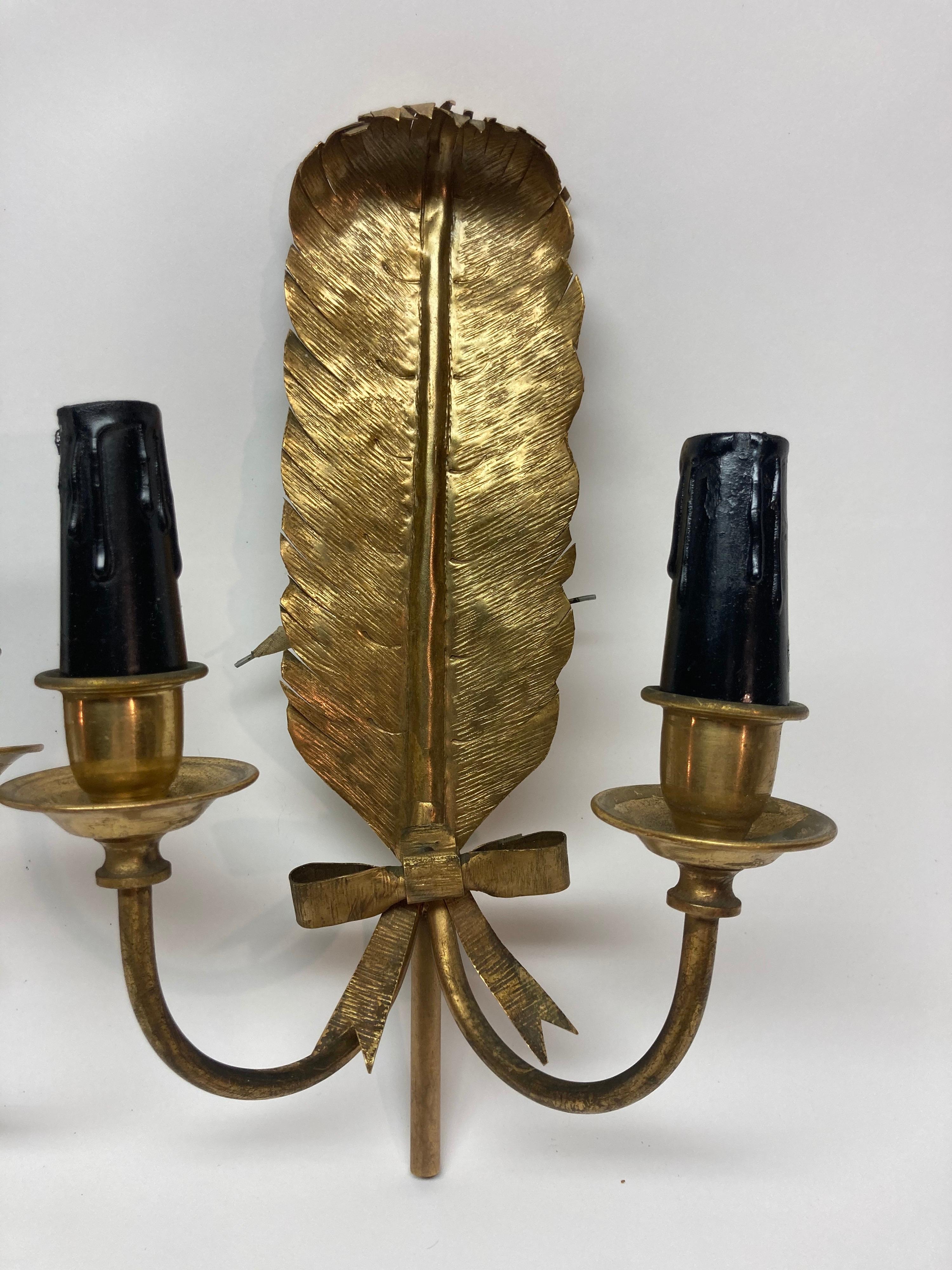 Wonderful pair of brass feather sconces with original wiring.... very unique.