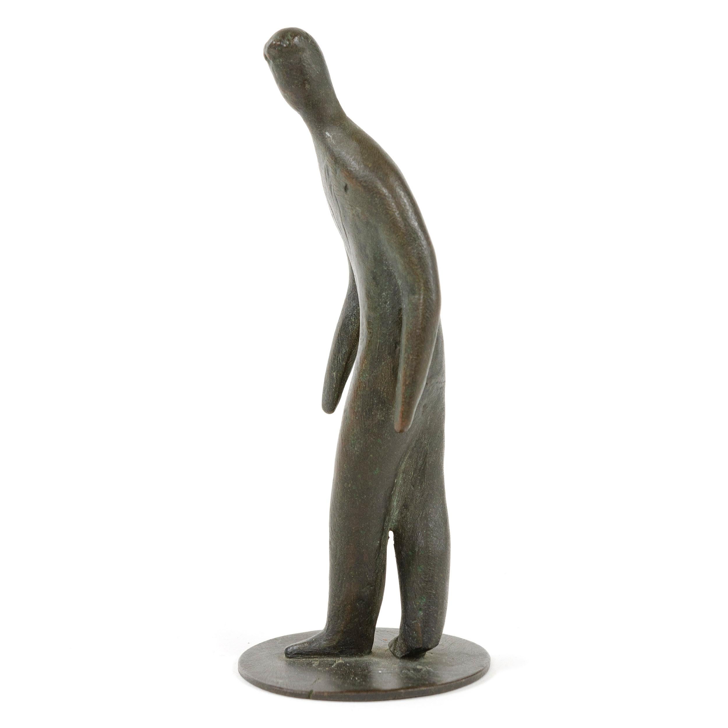 An uncommon Mid-Century Modern brass figure of a gentleman in mid-step.
Designed and Manufactured in Austria by Carl Auböck, 1930s.