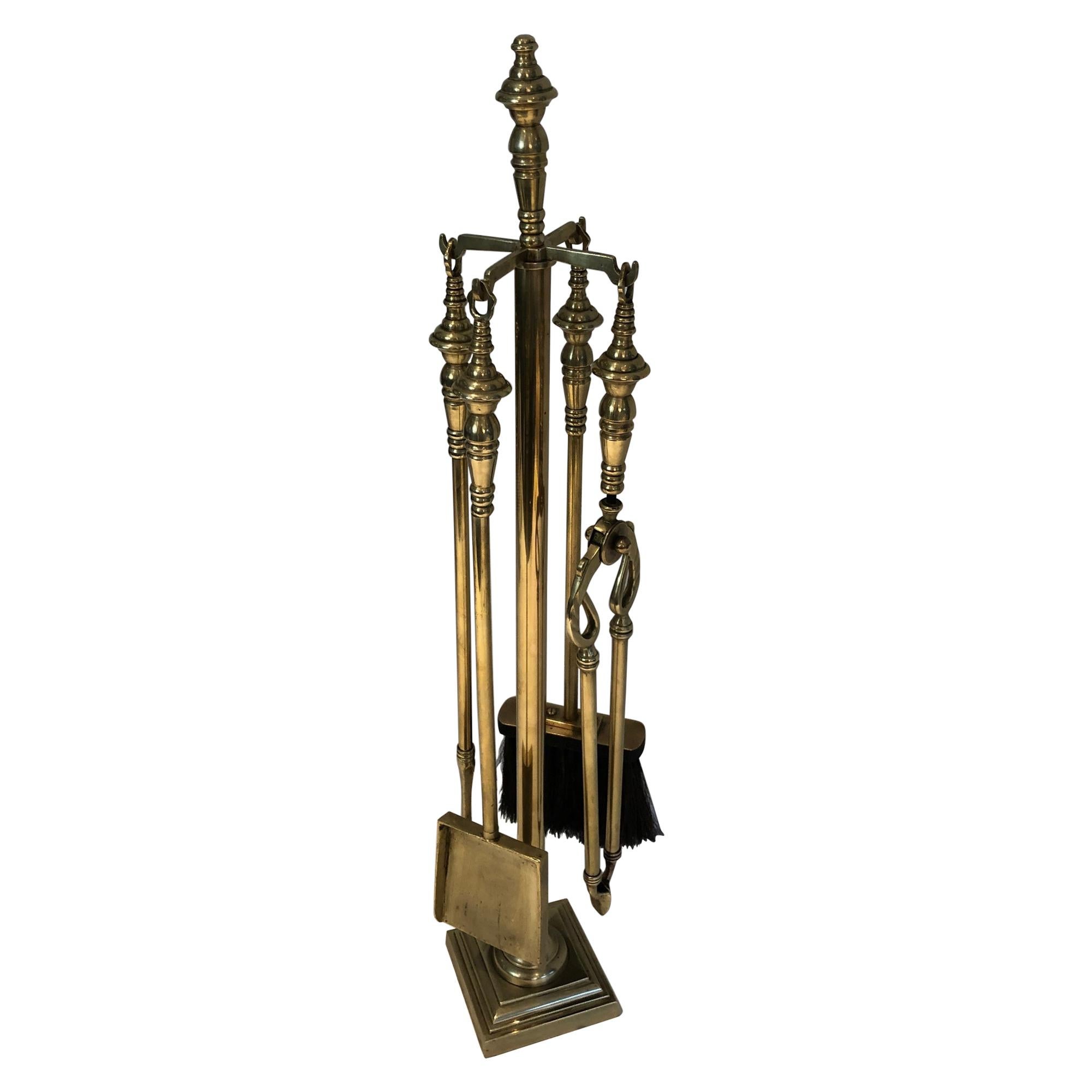 This is fire place tools on stand is made of brass. This is a French work, circa 1970.