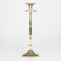 Brass fireplace companion set with a pair of fire dogs with hanging fire tools