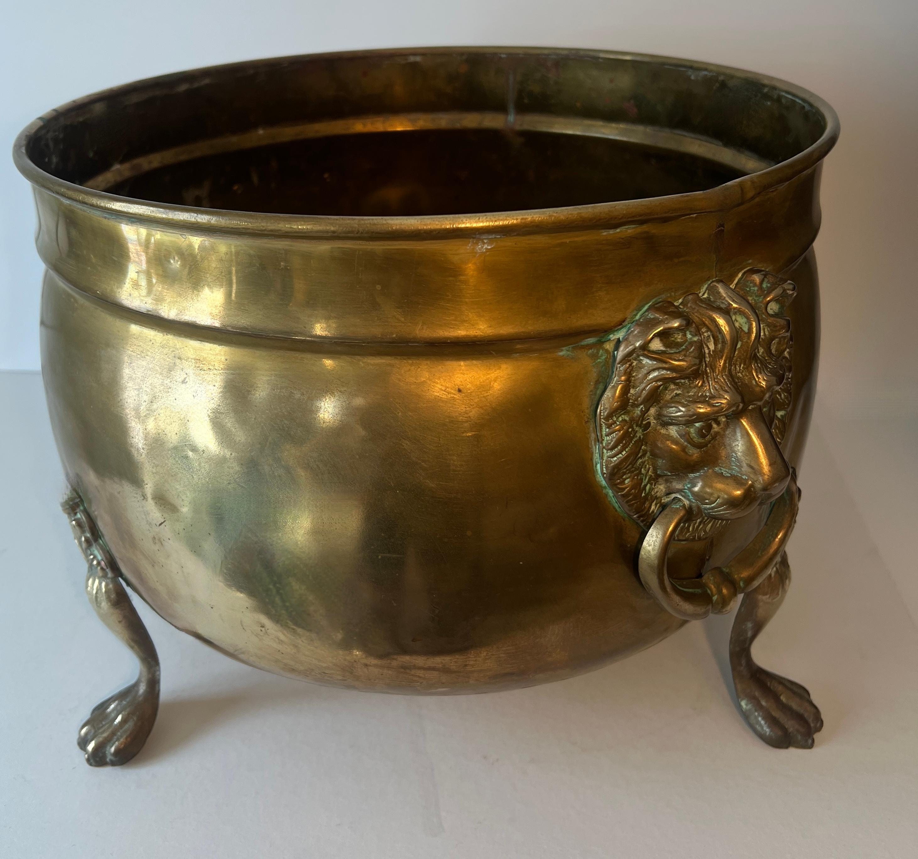 Patinated Brass Fireplace Pot or Planter with Lion and Ring Handles For Sale