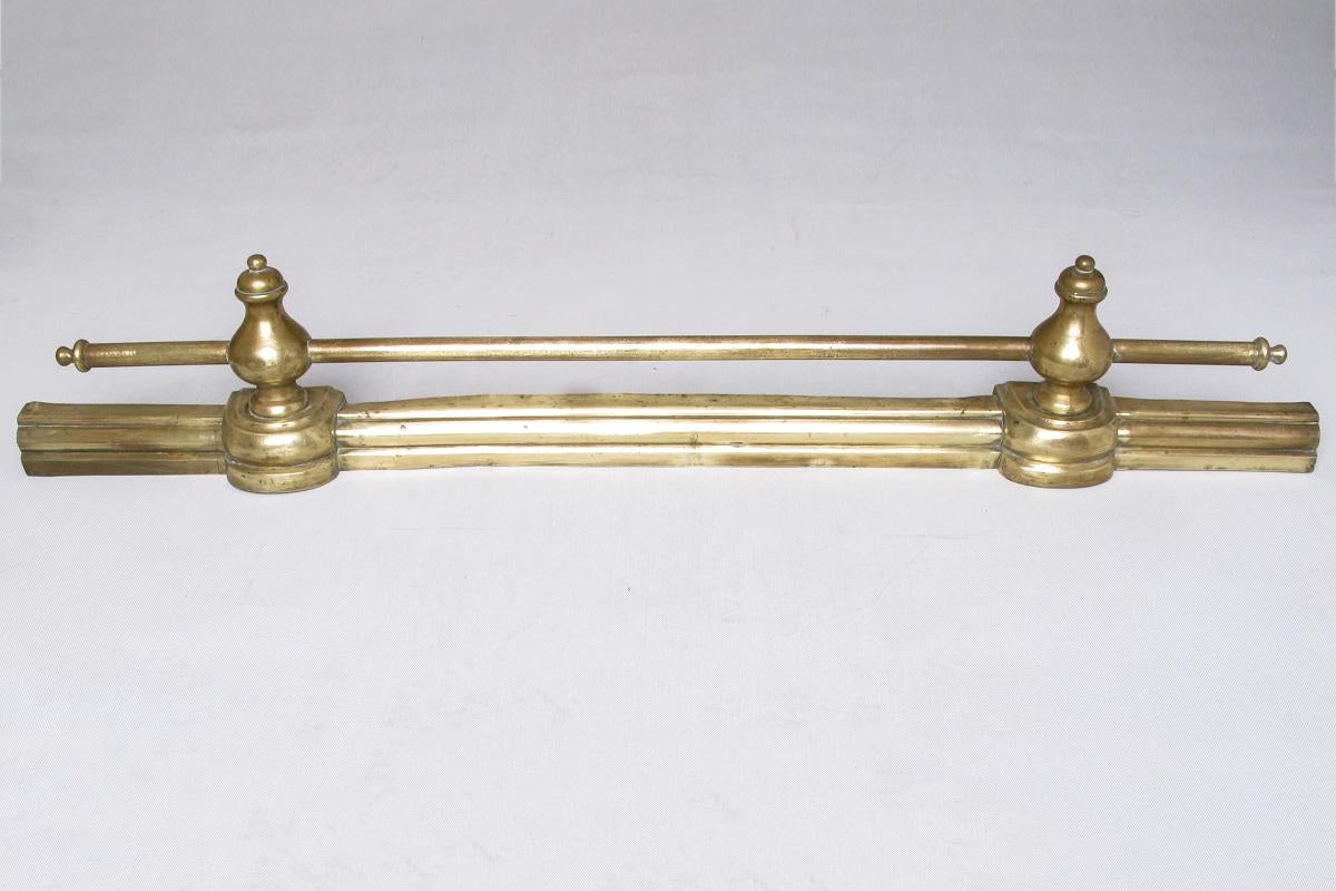 Simple classical andirons for fireplace, complete with brass fender: perfect, elegant, helpful. 
So You can complete Your fireplace with a good price.
Andirons are: cm. 42 x 9 x H 24 cm.