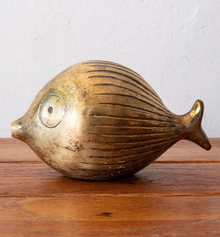 Brass fish coin bank by Ben Seibel for Jenfred-Ware. Rubber stopper is removable to access the coins. 1950s.