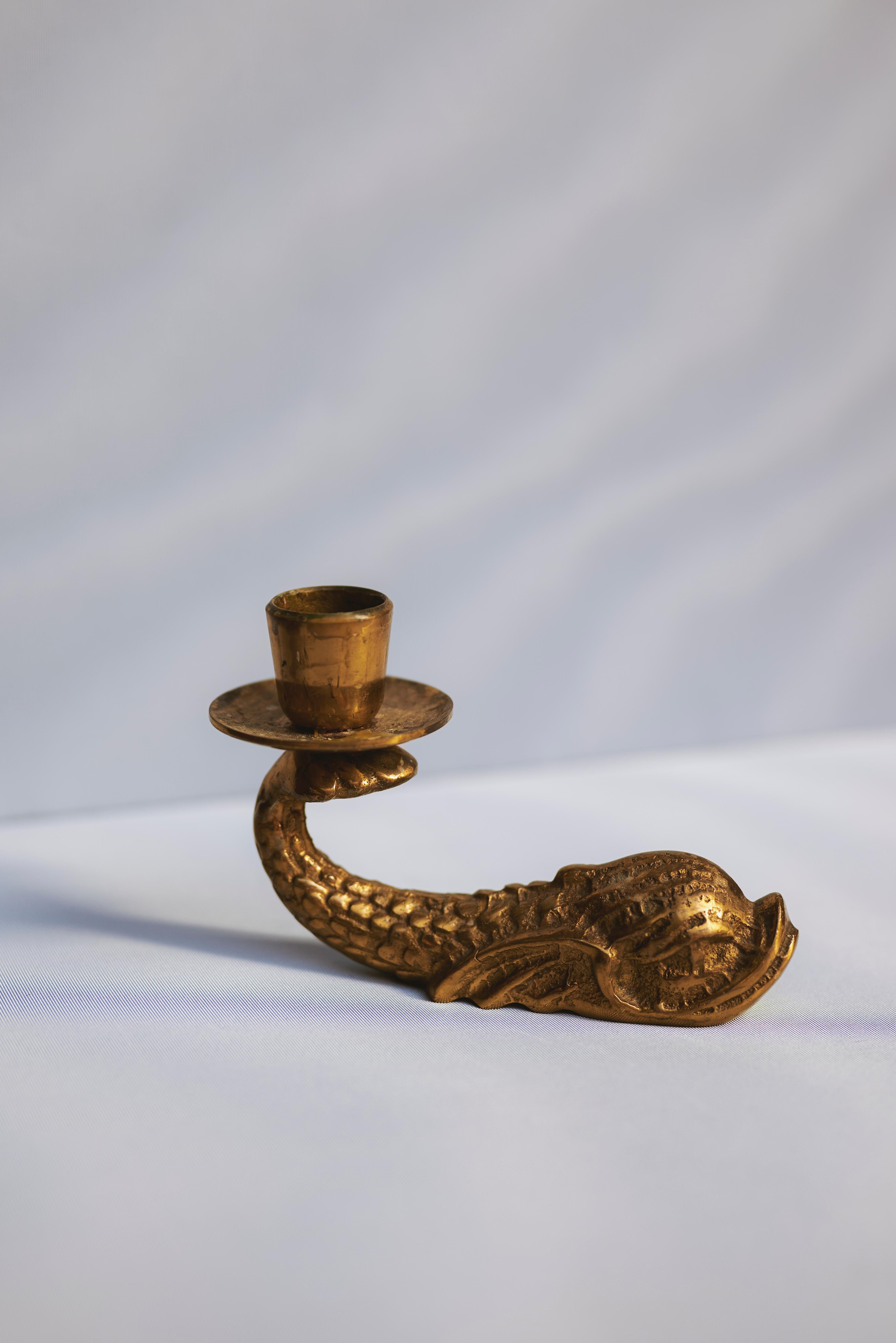 Brass Fish Candleholder by F. Abela & Sons, Malta – Mid-Century Handcrafted Design

Single brass candleholder in the shape of a stylized fish, handcrafted by F. Abela & Sons, Malta. Likely produced in the mid-20th century, this sculptural piece