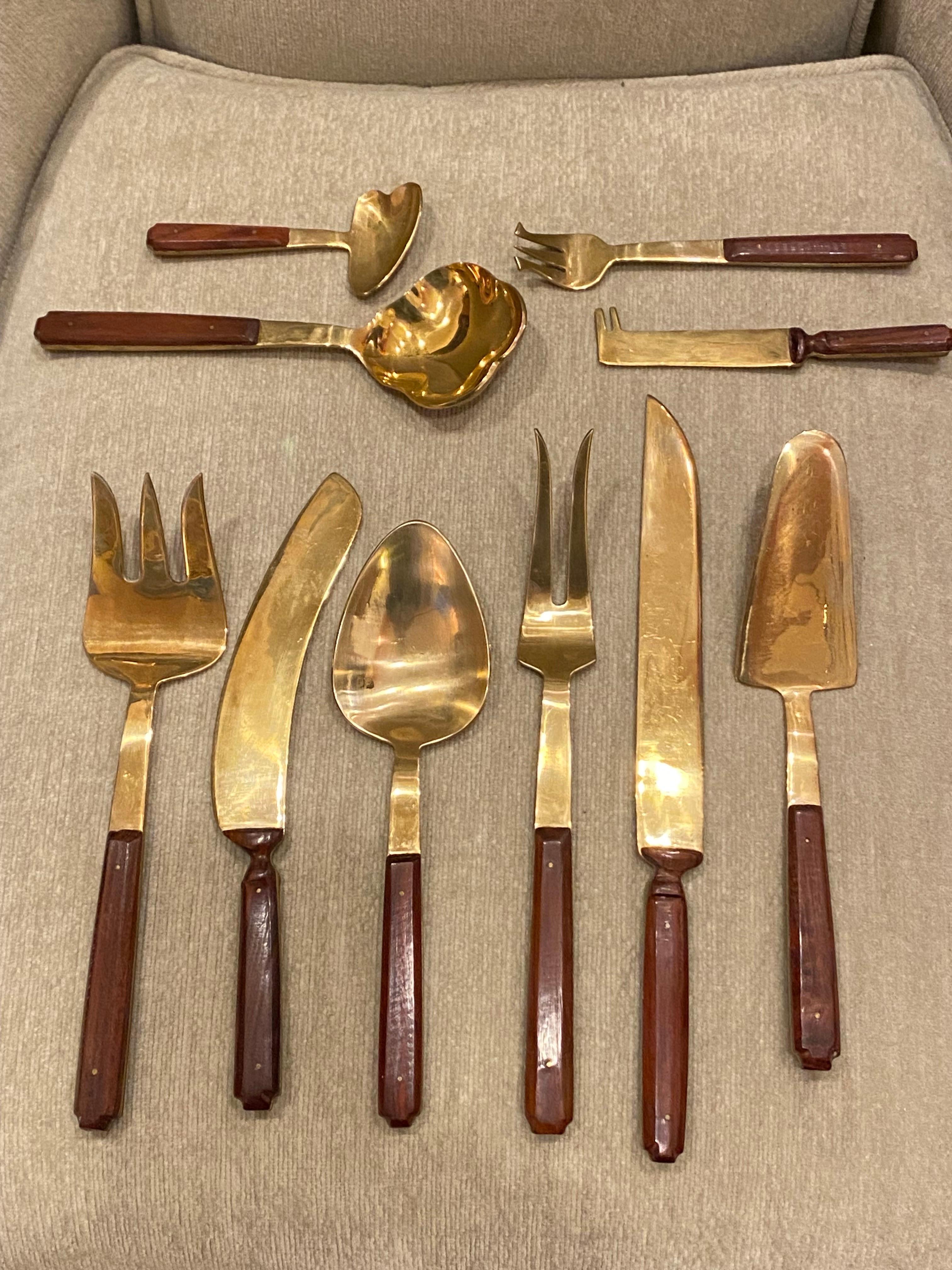 Massive Brass and wood Flatware Set.  142 piece in all! 12 place settings, each place setting includes 11 pieces!  90% of set was unused and still in plastic sleeves.  Some pieces show tarnish, have been lightly cleaning the set and overall in nice
