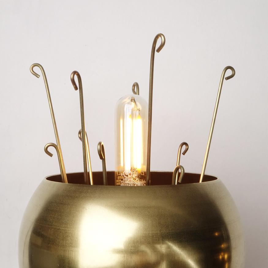 A simple modern sconce to accent your bedroom, bathroom, or work space. This contemporary light also works well in a commercial setting restaurant, retail, or office space.

Designed by Michele Varian
Unfinished brass and glass (clear coat can be