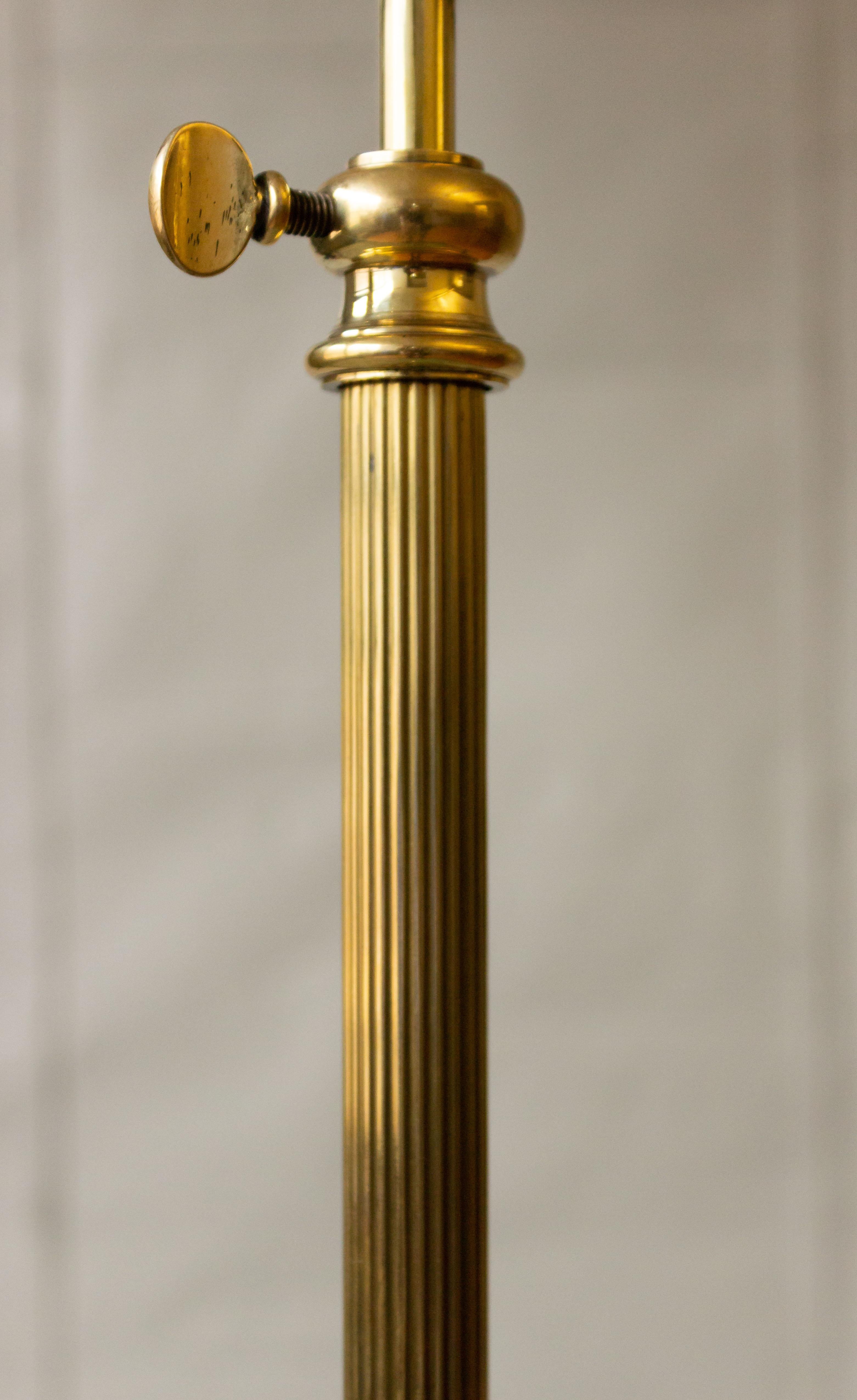 Brass floor lamp with tripod bases ending on hooves. Maison Jansen, circa 1940. Not sold with shade.