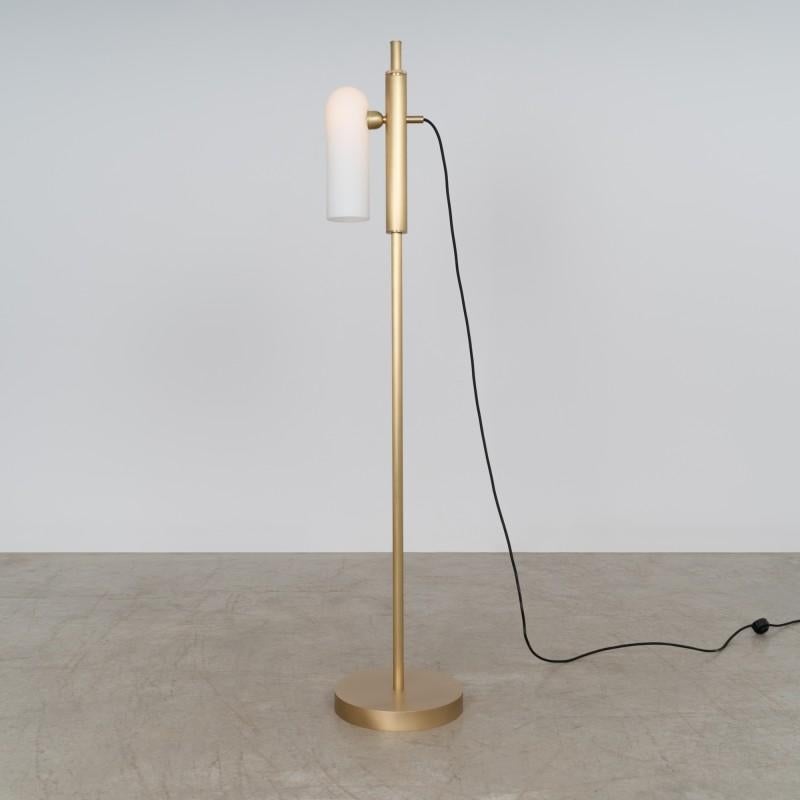 Brass floor lamp by Schwung
Dimensions: D 30.5 x H 154 cm
Materials: Metal, Triplex Opal Glass, LED
Wight: 12.3 kg

Brass beacons with a delicate glow. The Odyssey floor lamps are striking markers of an inner architecture. An elegant line