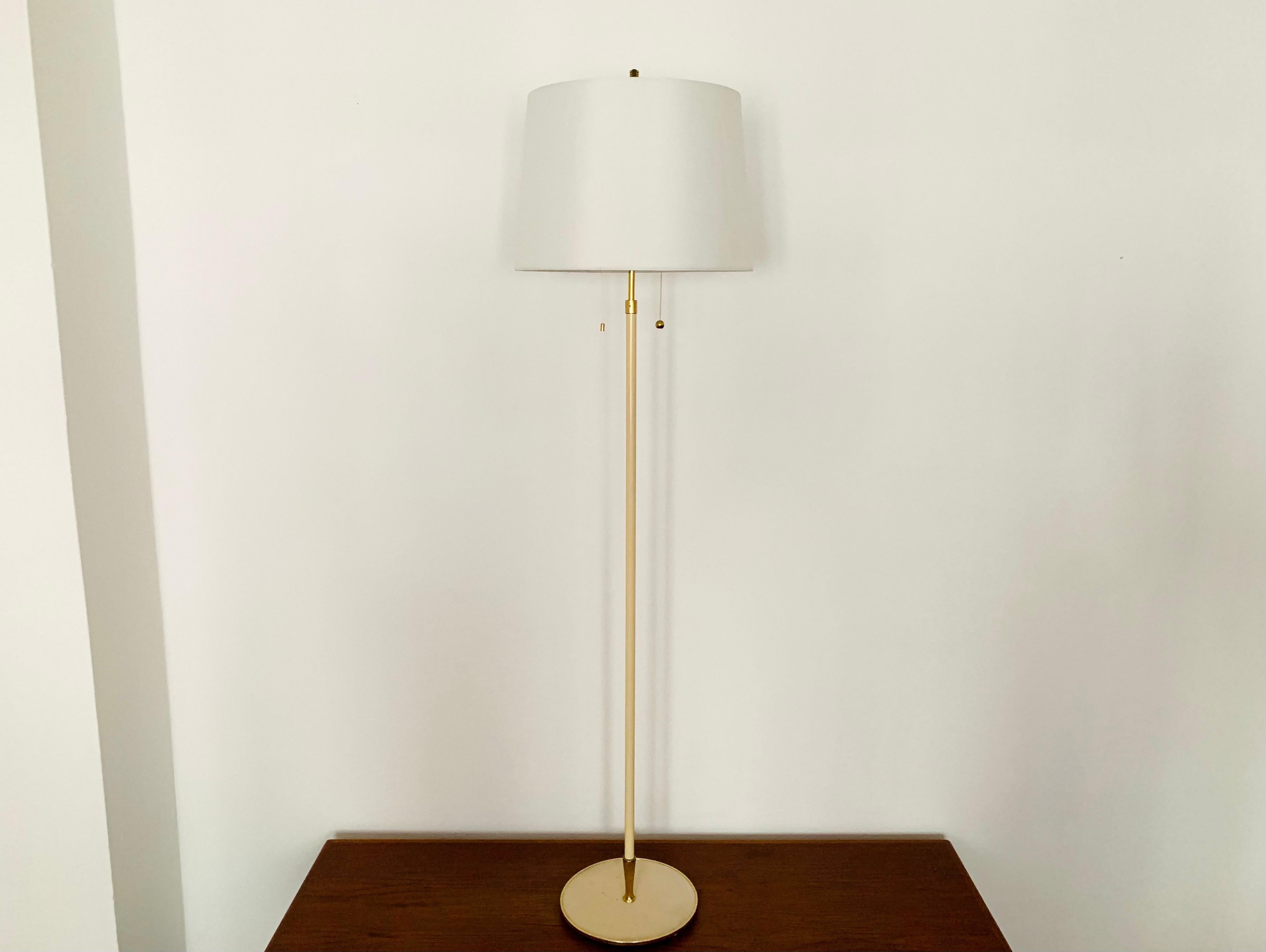 Very nice floor lamp from the 1950s.
Great design and very high quality workmanship.
The loving details and the very pleasant lighting effect make the lamp special and a real favorite.

Manufacturer: Vereinigte Werkstätten