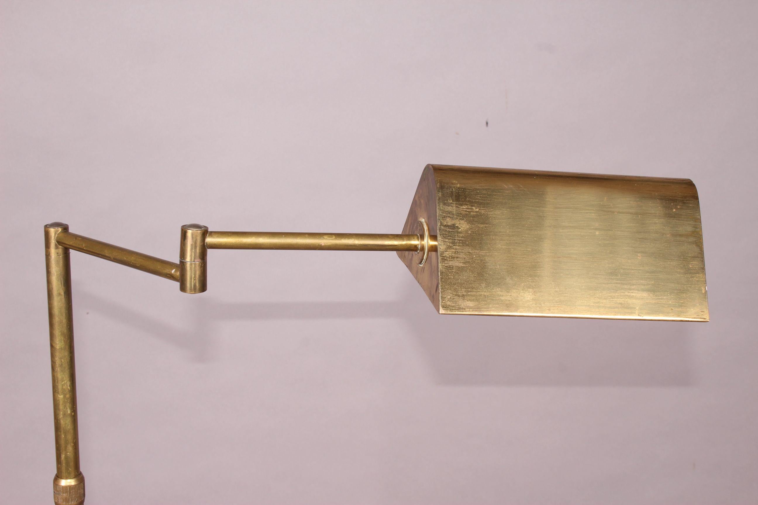 Adjustable brass floor lamp.