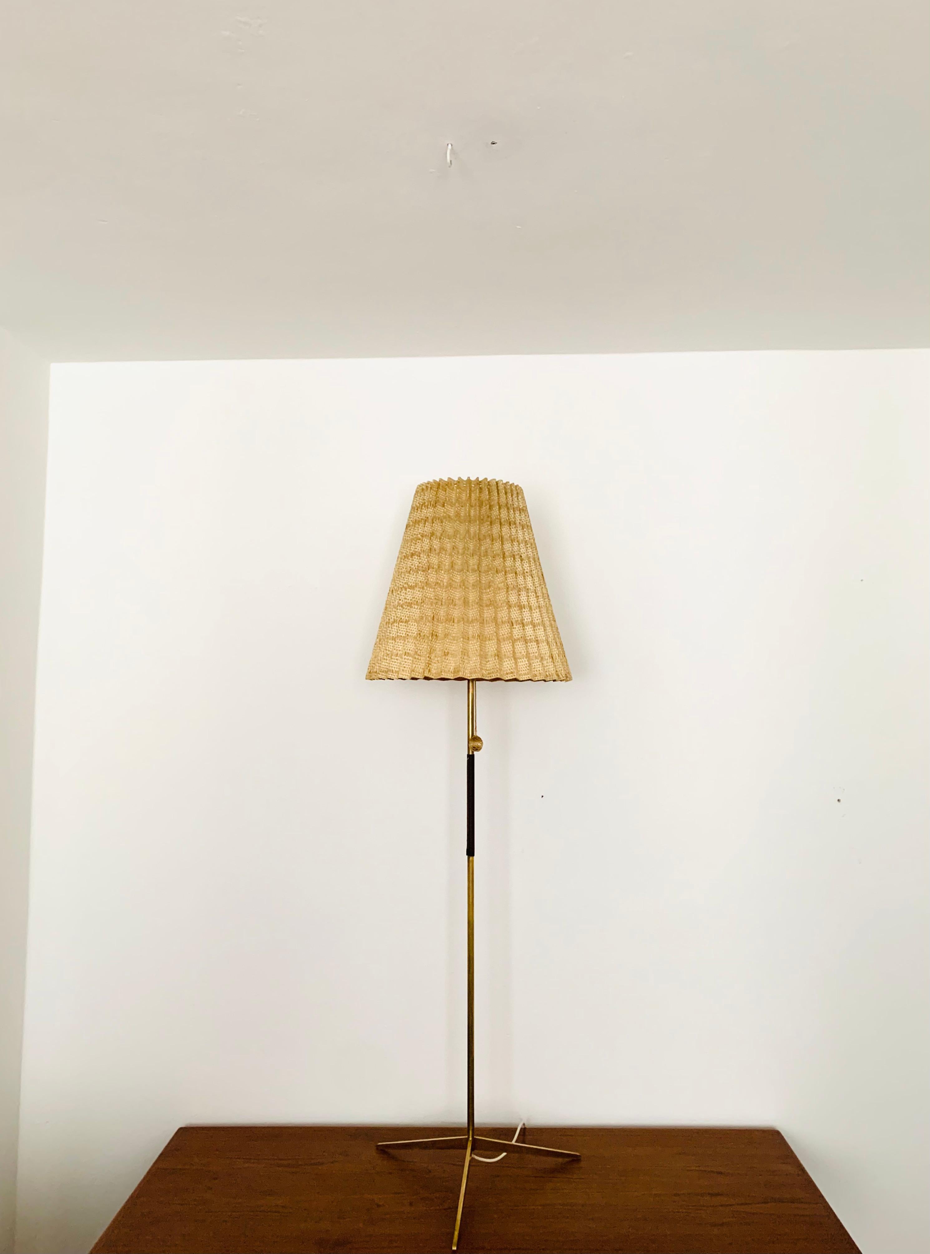 Very nice brass floor lamp from the 1950s.
Great design and high quality workmanship.
The loving details and the very pleasant lighting effect make the lamp special and a real favorite.

Condition:

Very good vintage condition with slight