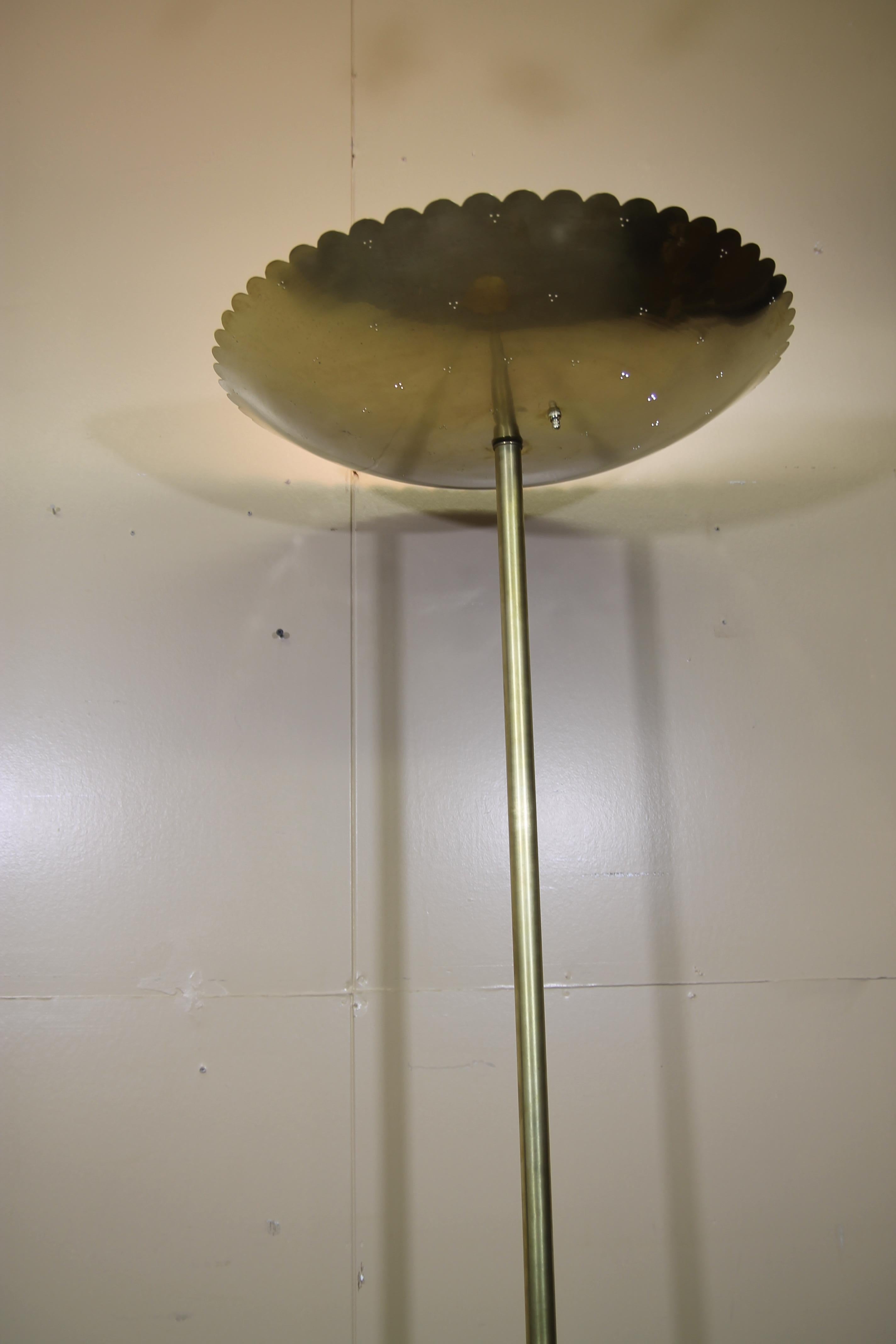 Im pleased to offer this wonderful brass floor lamp. I have not been able to confirm the manufacturer but it is in the style of Paavo Tynell. Really an amazing lamp in person. Lamp has been rewired and has a replacement switch. Has a 4 cluster