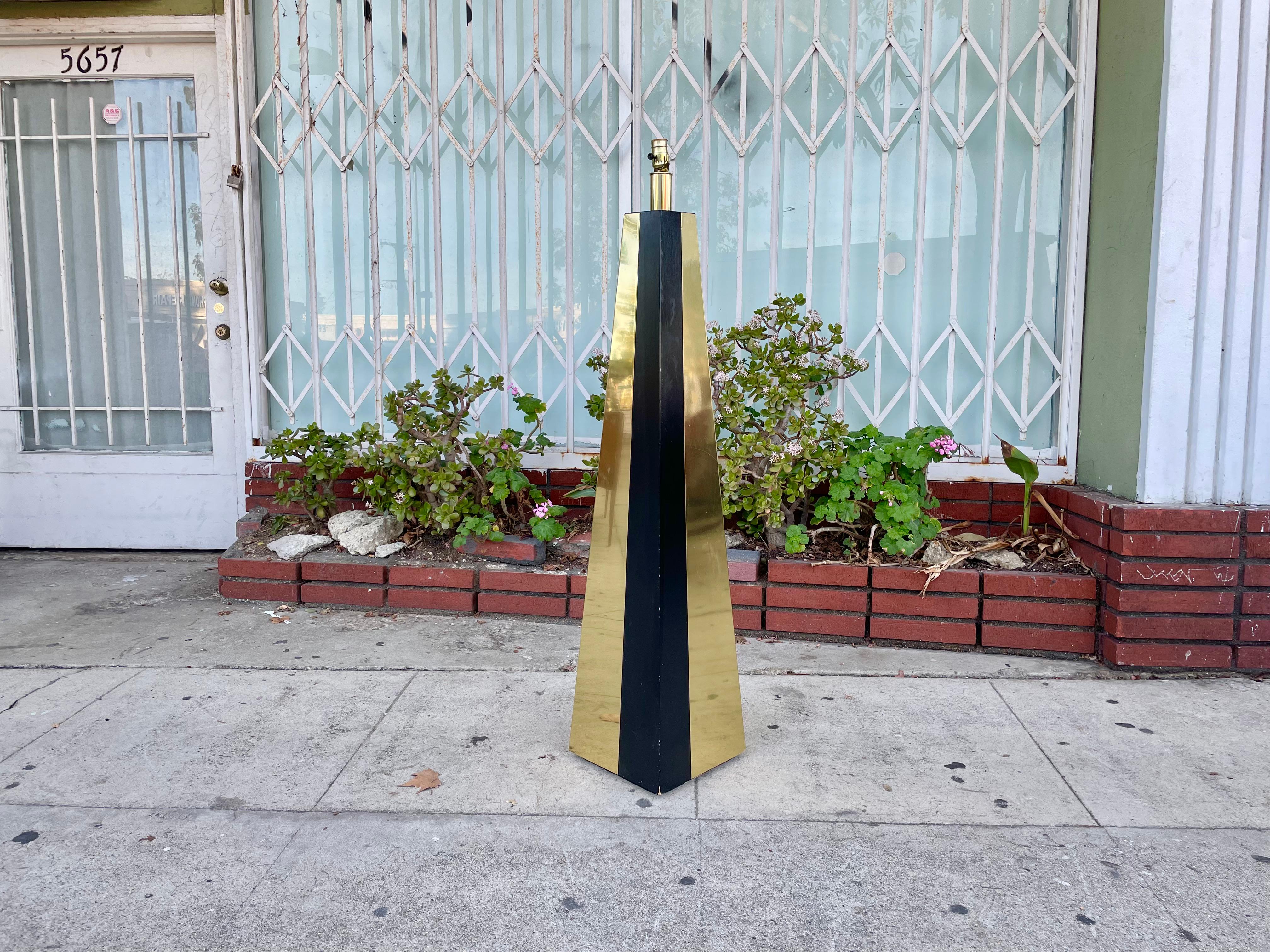 Beautiful Brass floor lamp Styled after Paul Evans; this floor lamp features two strips of brass facing opposite directions giving it that mid-century style.