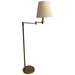 Brass Floor Lamp with Adjustable Arm and Cream Color Shade