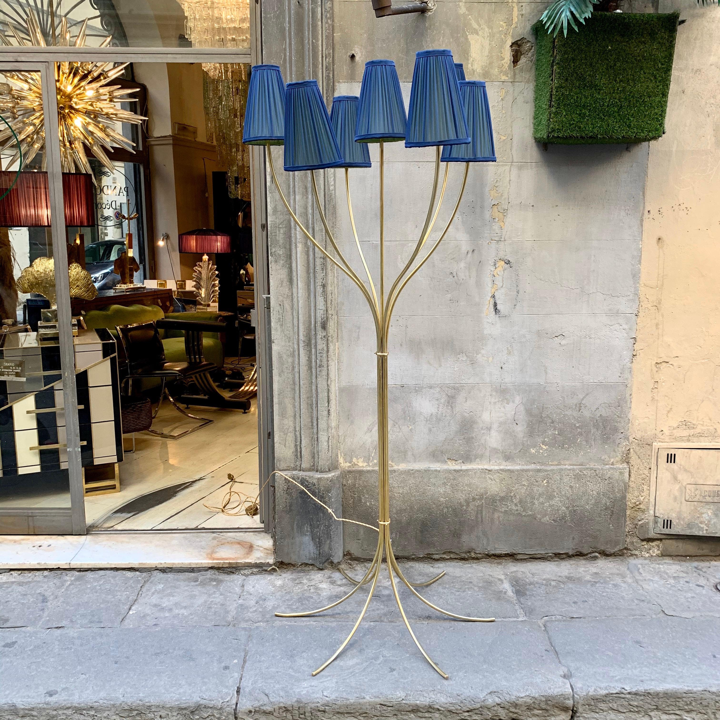 Brass floor lamp with 7 brass arms each ends with its lampshade. Our Lampshades are handcrafted in double pleated silk chiffon, acid green inside and royal blue outside. When the light is on the colors mix creating an amazing effect.
The floor lamp