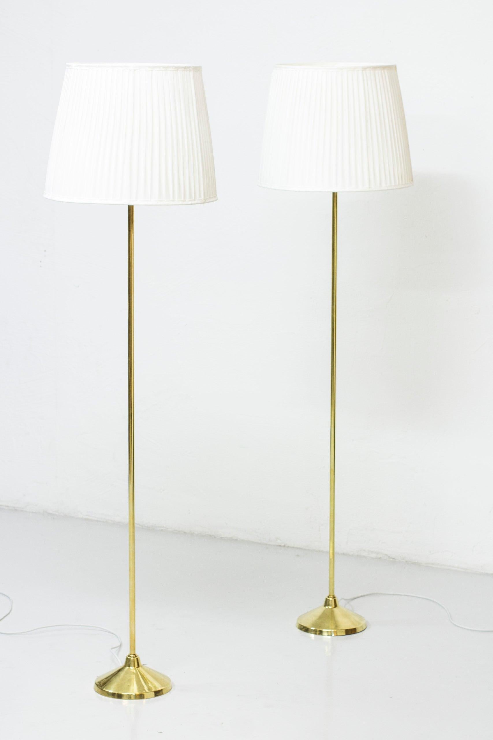 Scandinavian Modern Brass Floor Lamps by Hans-Agne Jakobsson, 1950s, Sweden, hand sewn shades For Sale