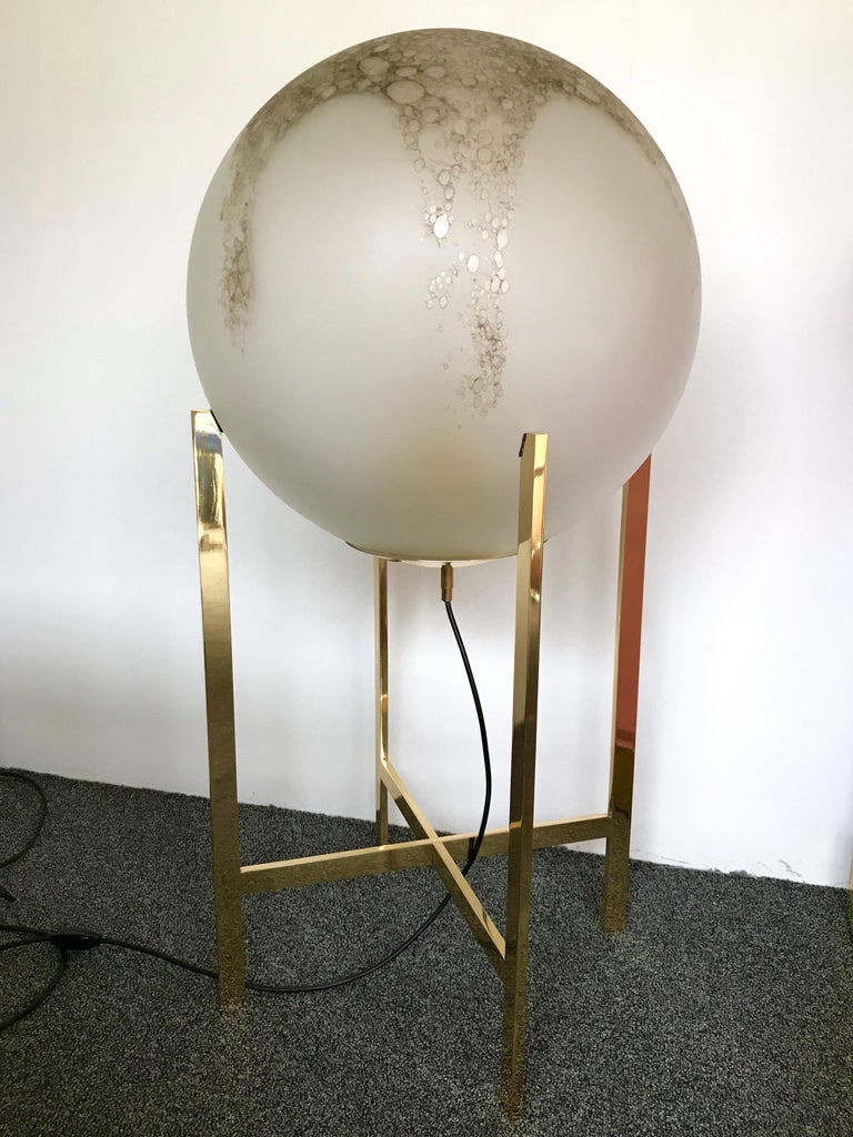 Impressive and very decorative floor lamps or huge table lamp by La Murrina Murano. Sandblasted frosted blown glass sphere with iron oxid, which gives it this bronze color, the aspect seems like alabaster stone. Simple and elegant polish brass