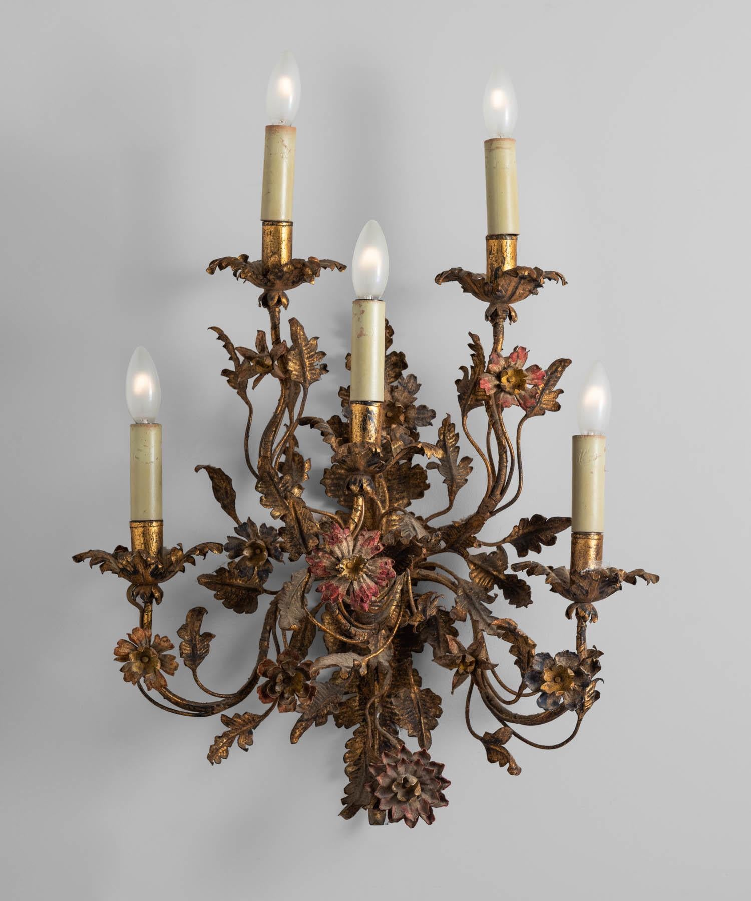 Brass floral sconce, Italy, circa 1910.

Intricate brass floral design holds (5) lights. Includes original red paint, wonderful patina, and detailing throughout.