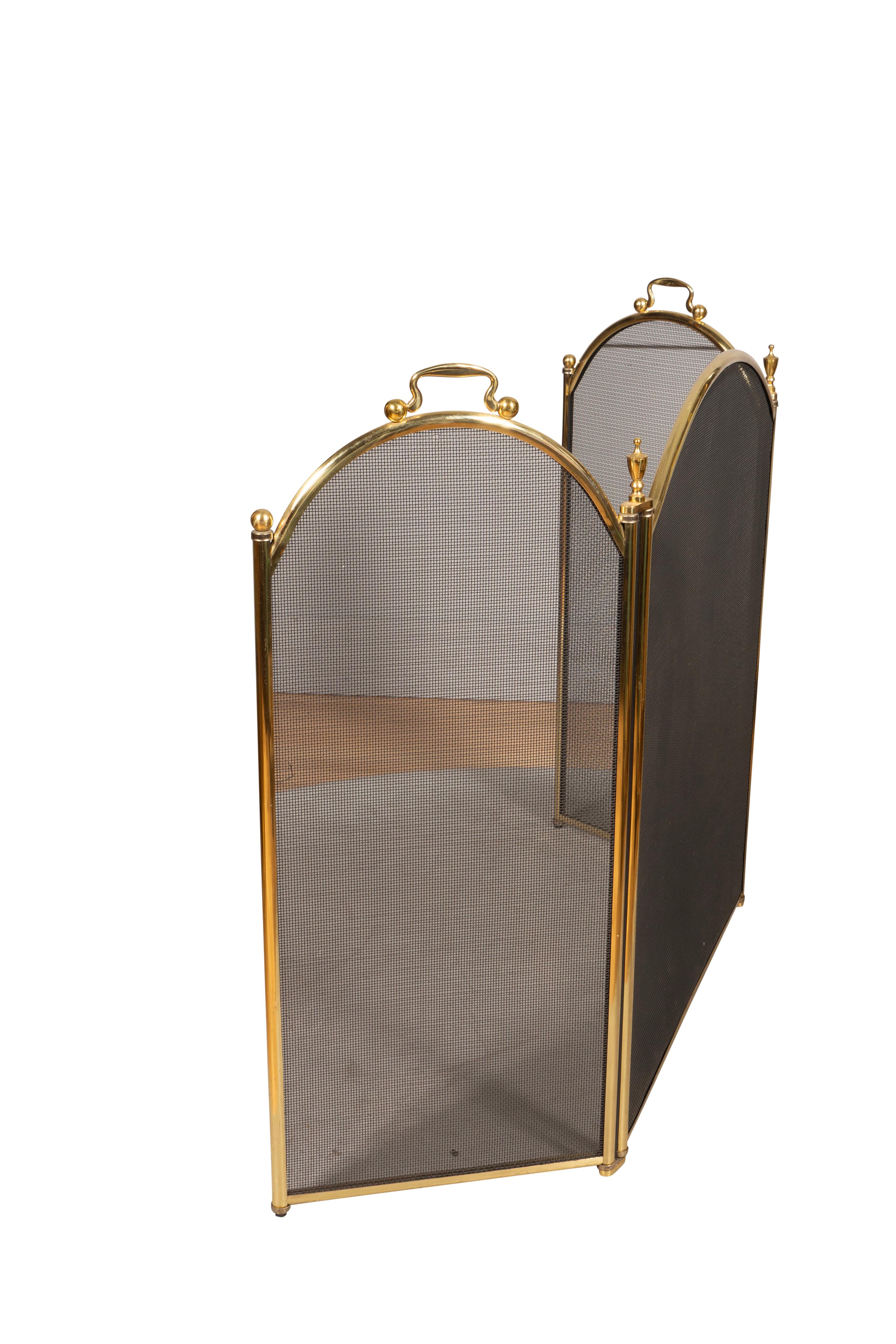 Central arched screen panel flanked by a pair of hinged panels. Urn finials and handles.