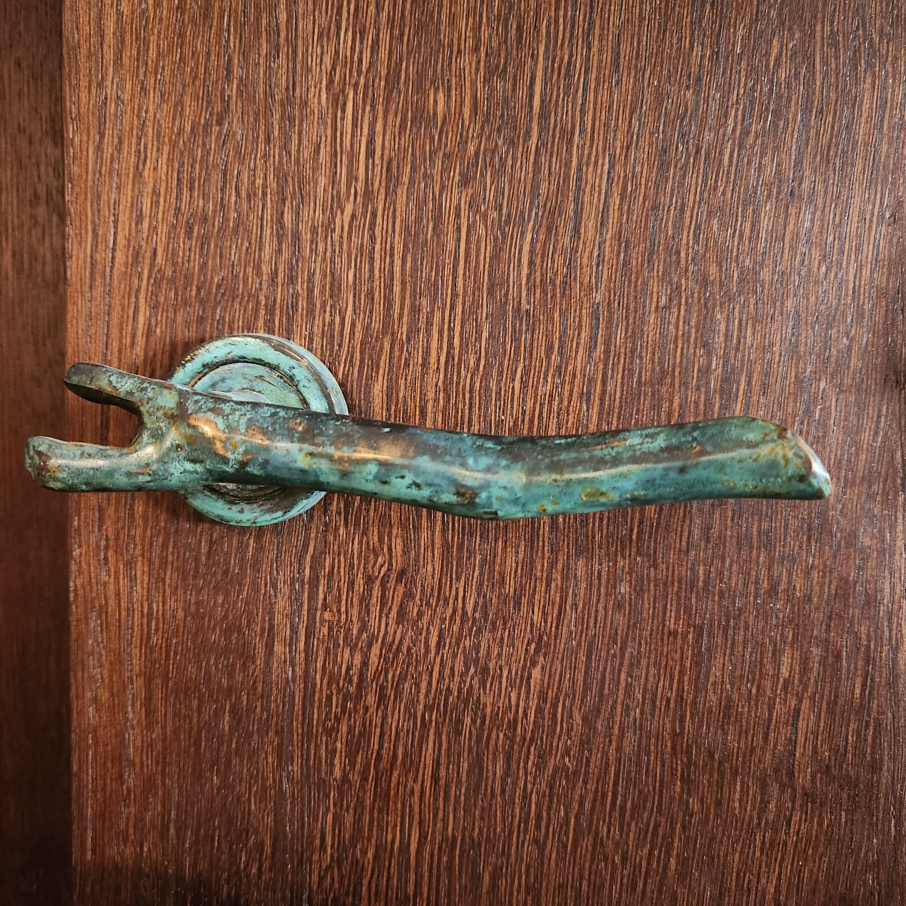 Pair of earth prints door handles in brass foundry. Tribute to nature, infinite source of patterns.