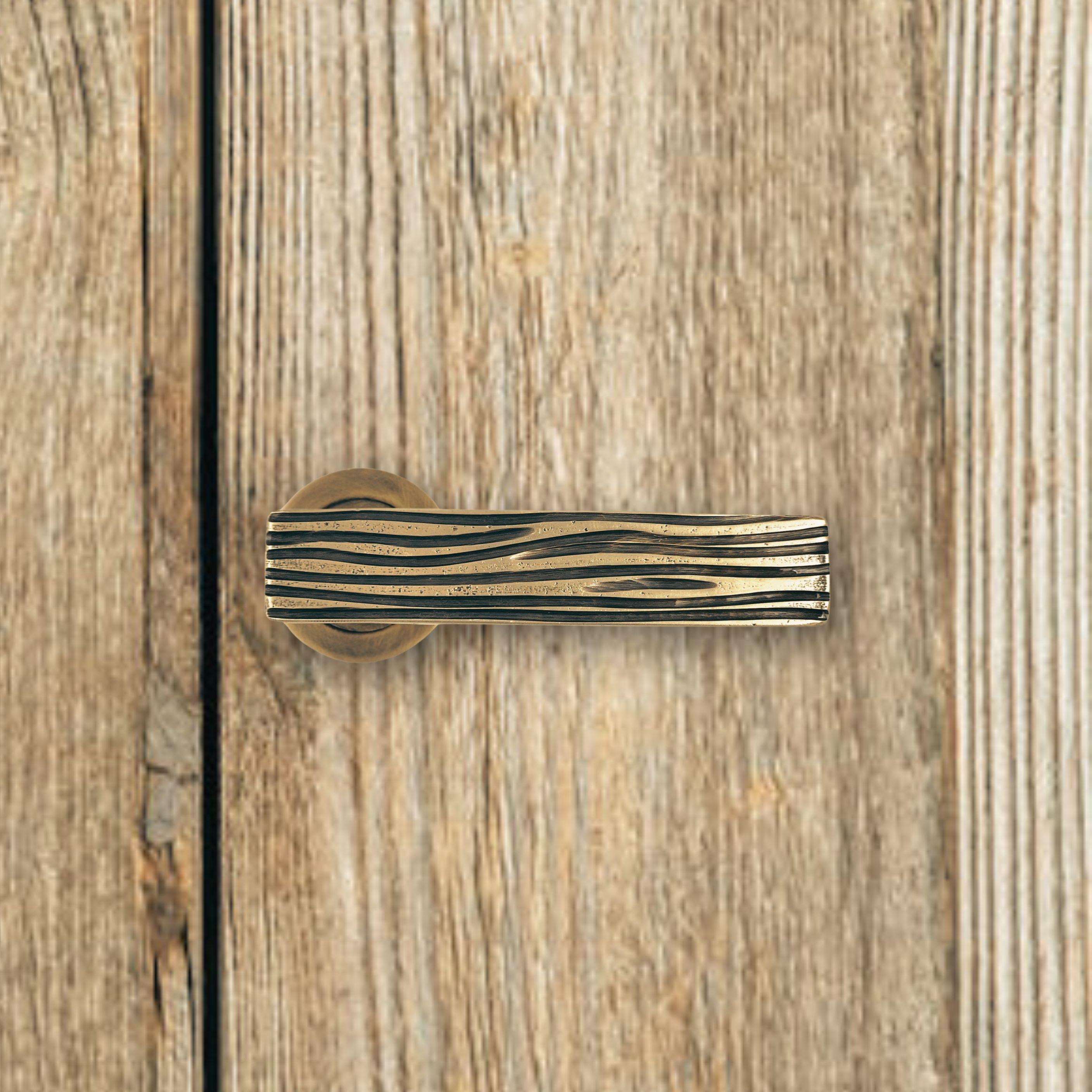 Hand-Crafted Solid brass lever handle with asymmetrical engravings For Sale