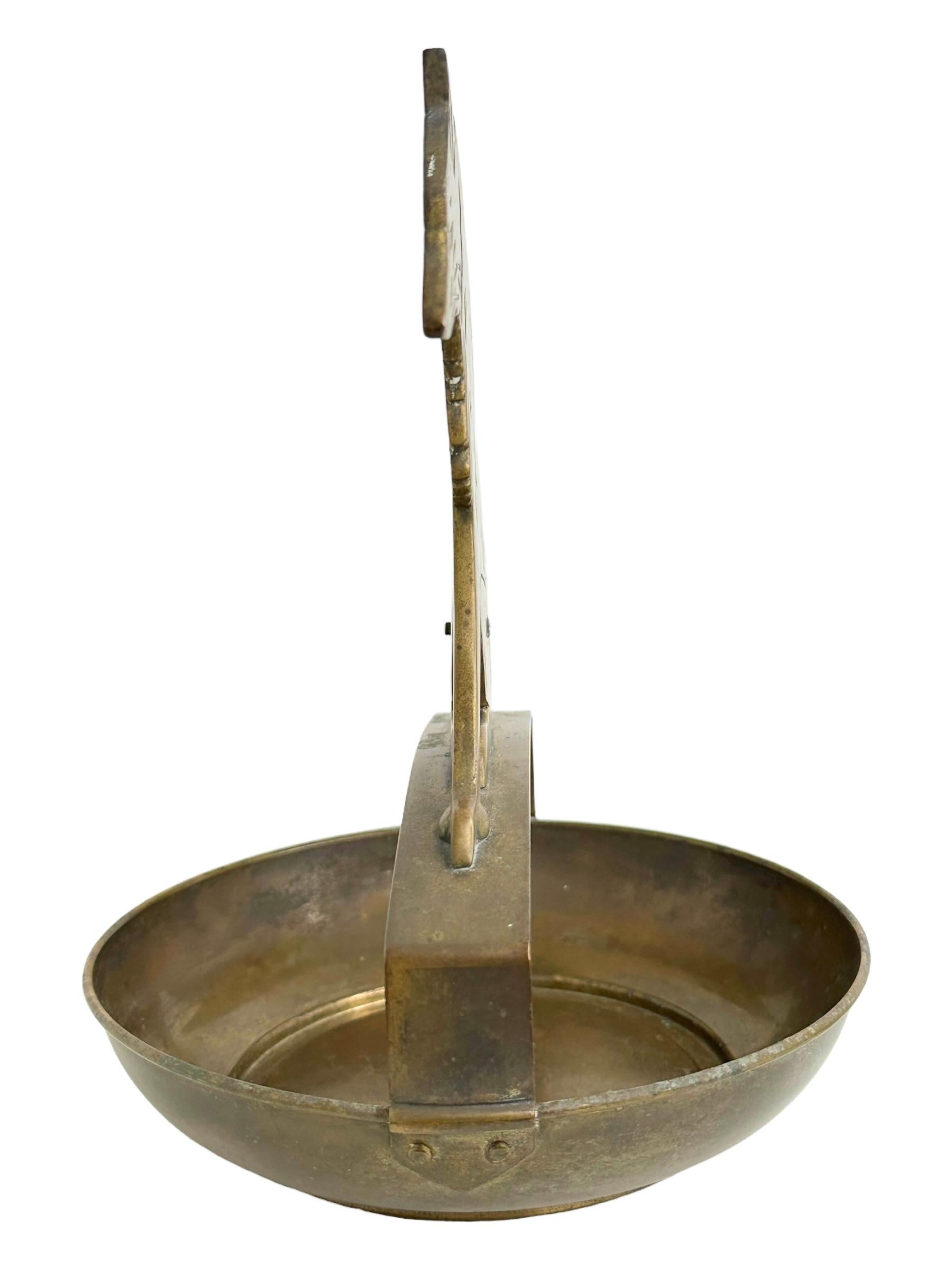 A beautiful cigar cutter and ashtray. Some wear with a nice patina, but this is old-age. Made of brass. Steel cutting blade at the tail. Blade rusty but this does not affect the function in any way. A beautiful nice collectible item or just a
