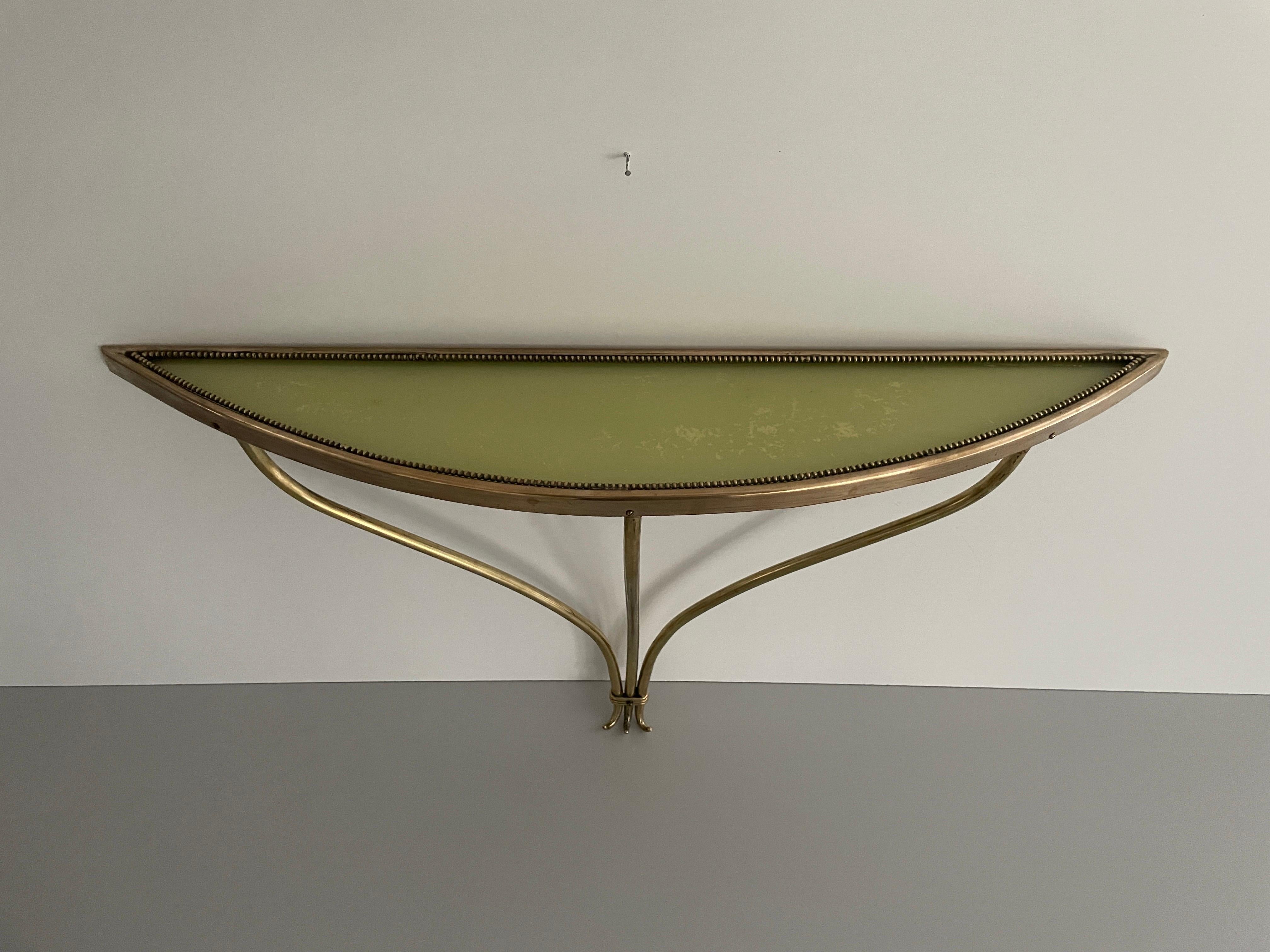 Brass Frame and Green Glass Top Floating Wall Console Table,  1960s, Italy

No damage, no crack.
Wear consistent with age and use.

Measurements: 
Height: 43 cm
Shelf: 65 cm x 13 cm x 2 cm