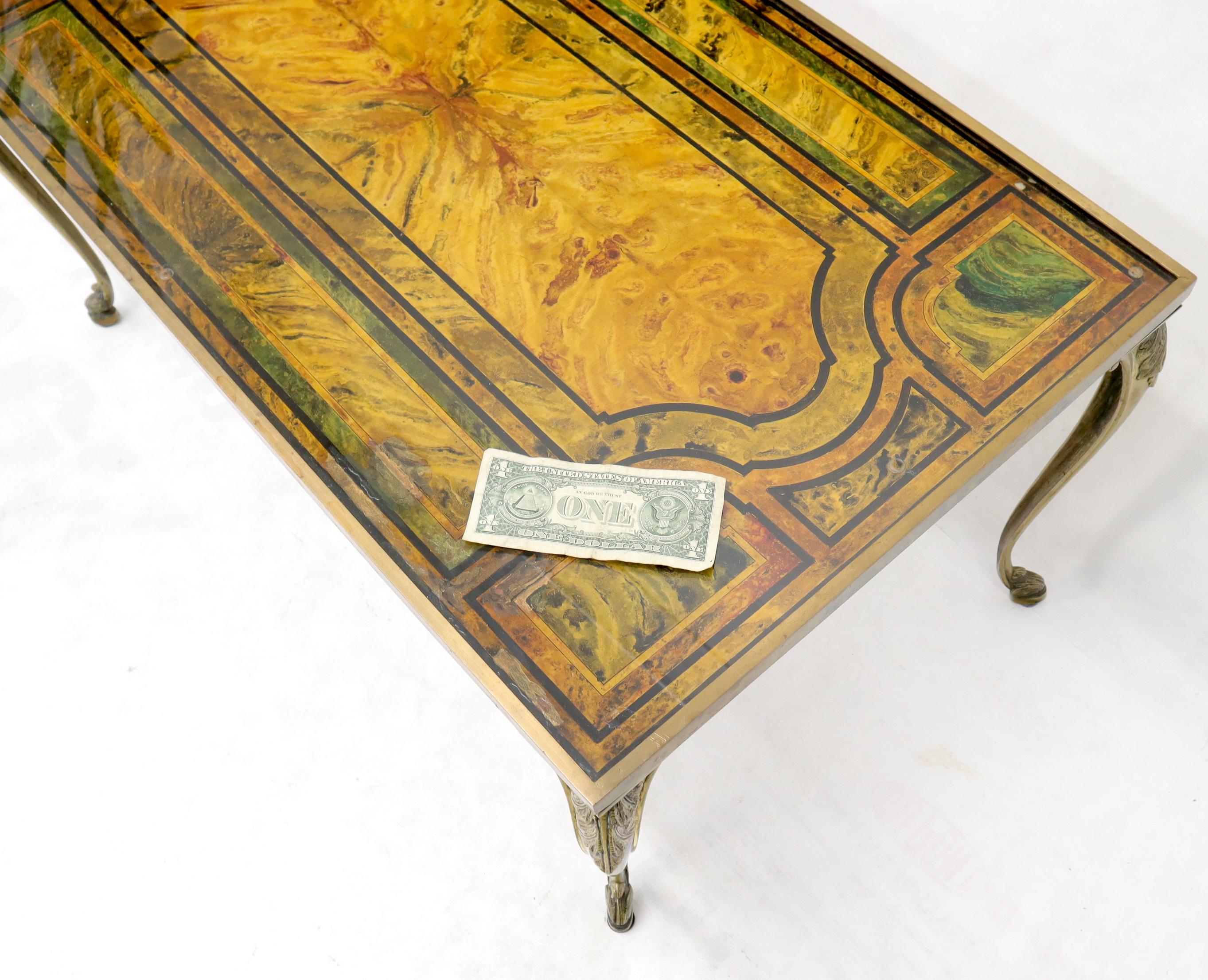 Decorative Hollywood Regency solid brass and heavy paint decorated marble-top insert rectangular coffee table.