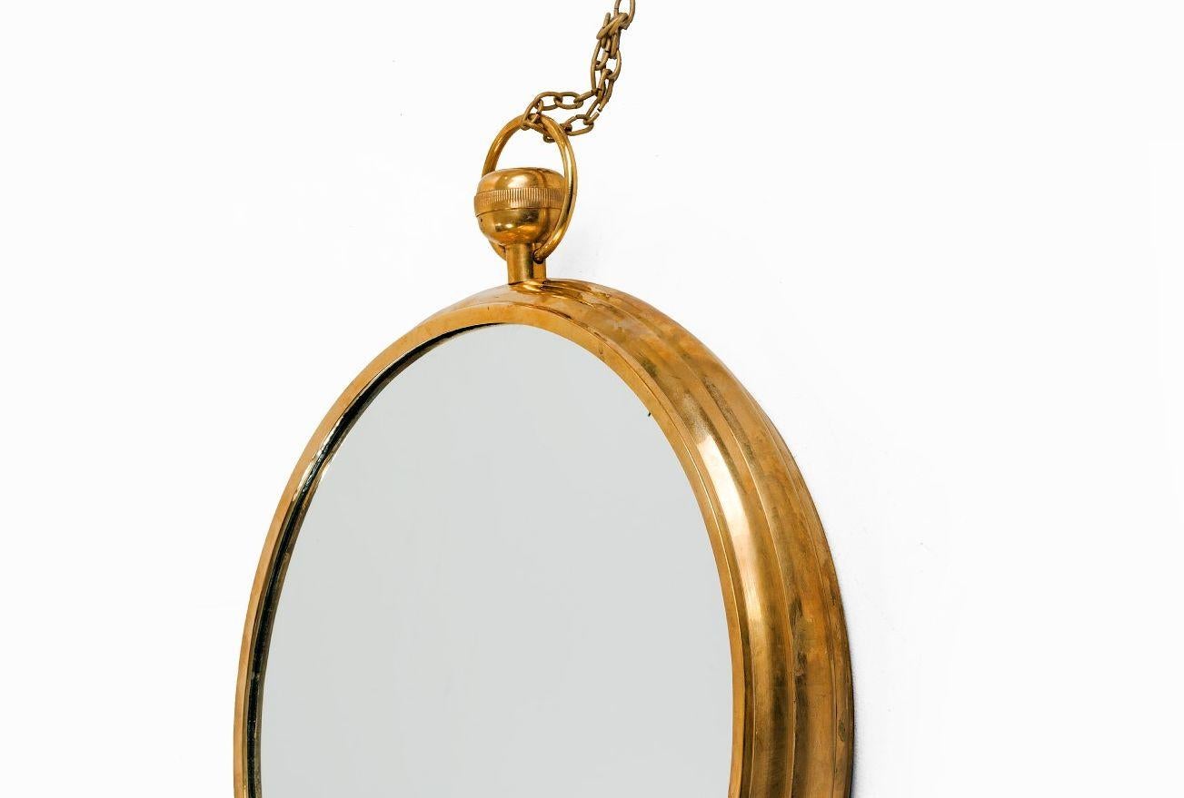 Mid-Century Modern Mid Century Modern Brass Framed Mirror in the Manner of Fornasetti For Sale