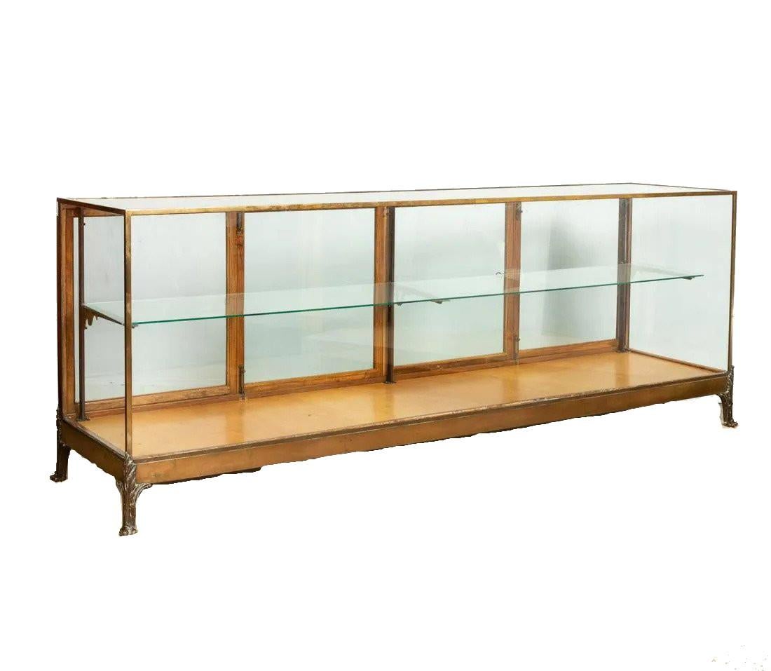 Early 20th century brass, ormolu & glass display case having acanthus leaf feet.
Dimensions: Height 36