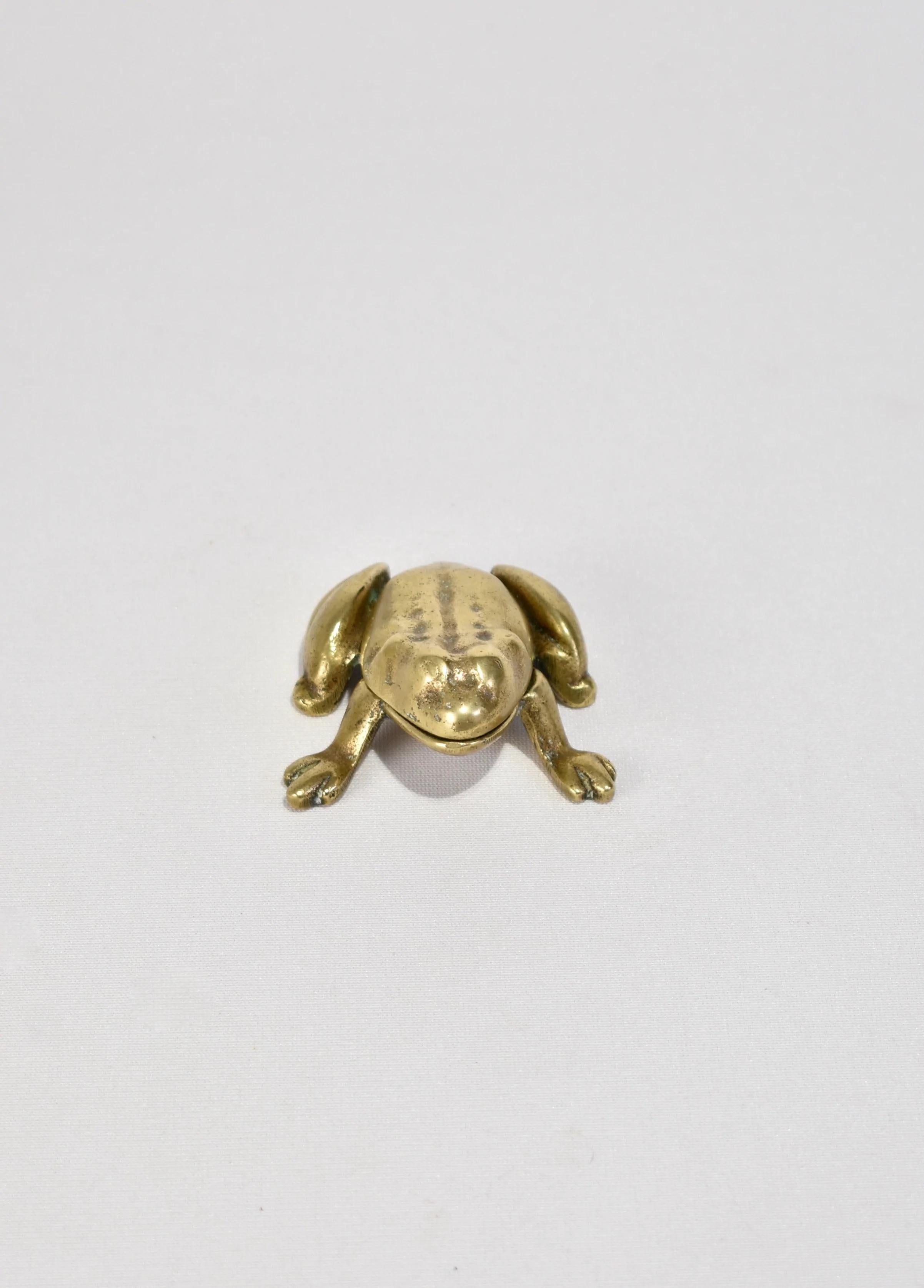 Vintage brass trinket box in the shape of a frog.