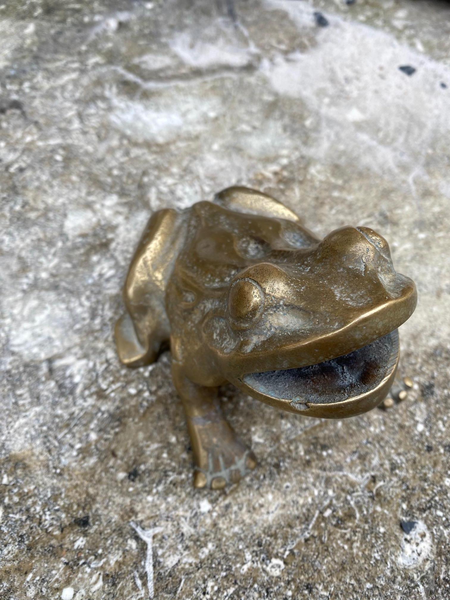 This brass spout is made in the form of a frog. Made for use on a fountain as a water exit. 

Measurements: 4.5