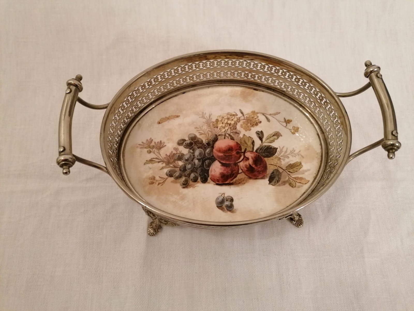Brass frame nickel-plated with ceramic base showing fruits motif. Made in Austria in the late 1920s.