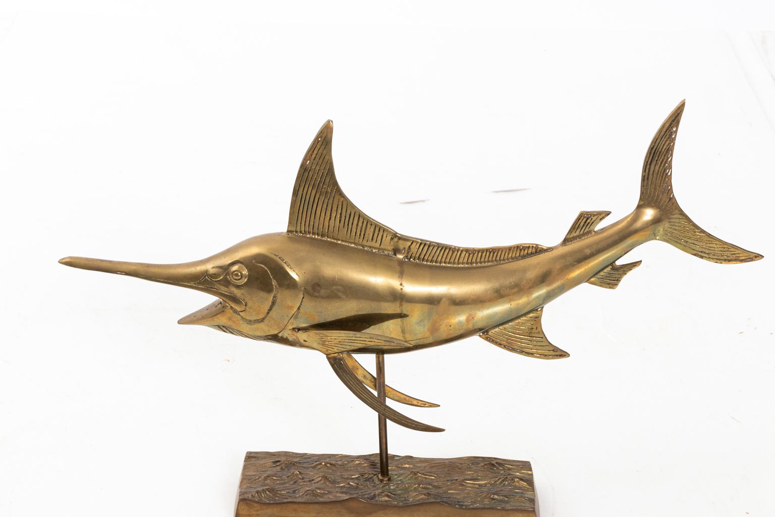 Large scale brass full body sail fish sculpture mounted on a rectangular brass base, circa 1970s. Please note of wear consistent with age including patina to finish. Made in the United States.